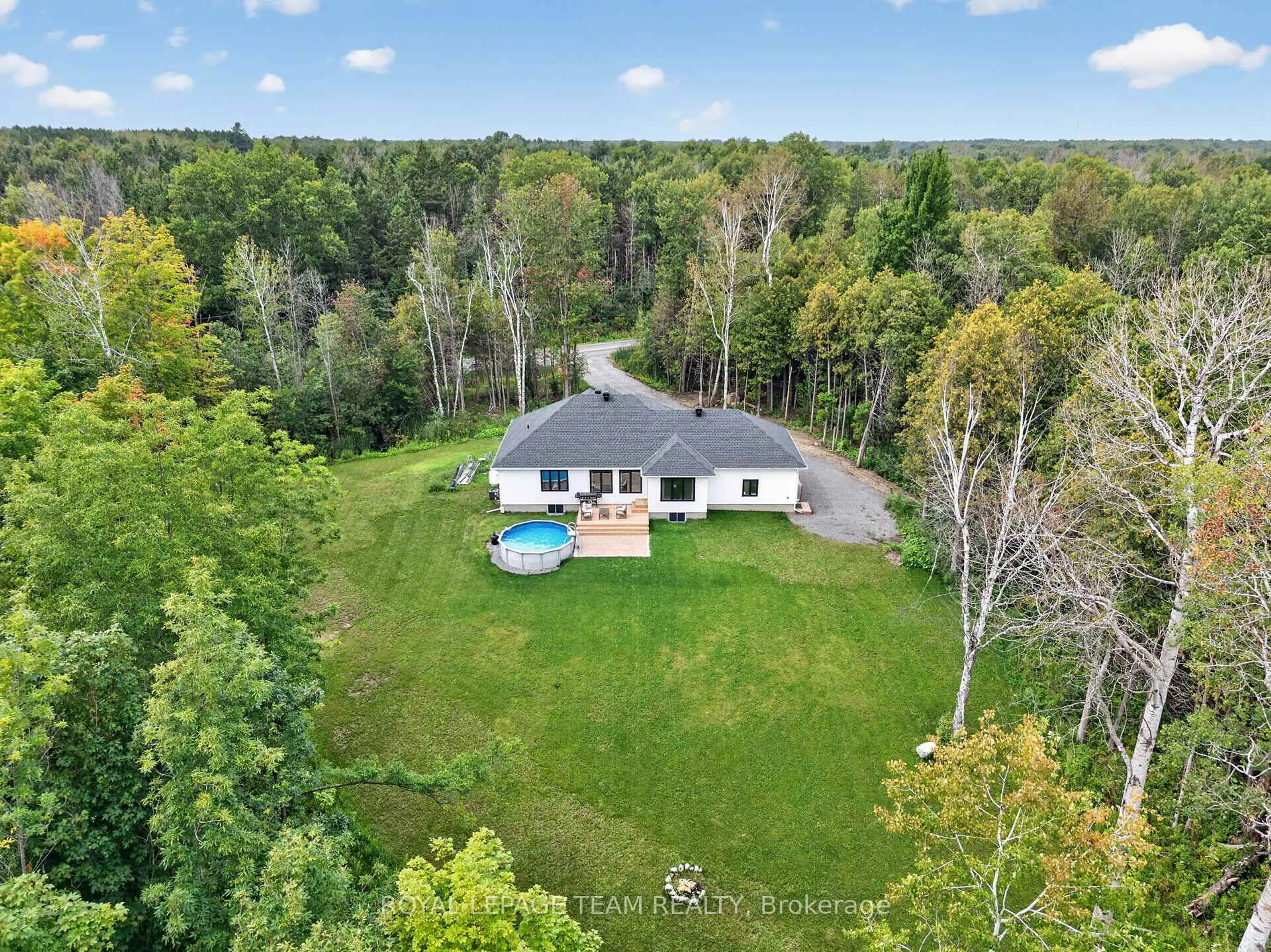 A pic from outside/outdoor area/front of a property/back of a property/a pic from drone, water/lake/river/ocean view for 1007 Townline Rd, North Grenville Ontario K0G 1T0