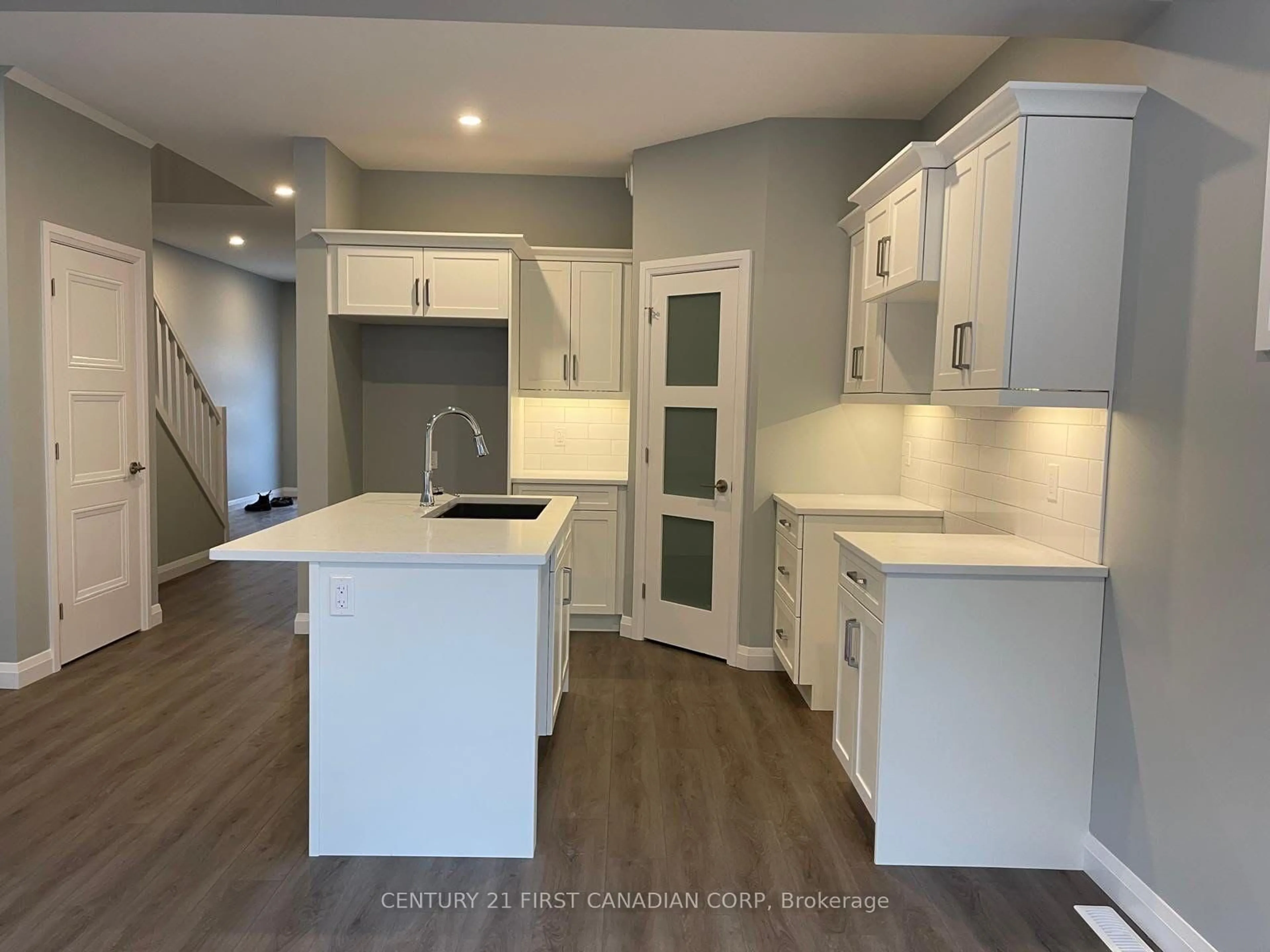 Open concept kitchen, wood/laminate floor for 1 Miller Dr #43, Lucan Biddulph Ontario N0M 2J0