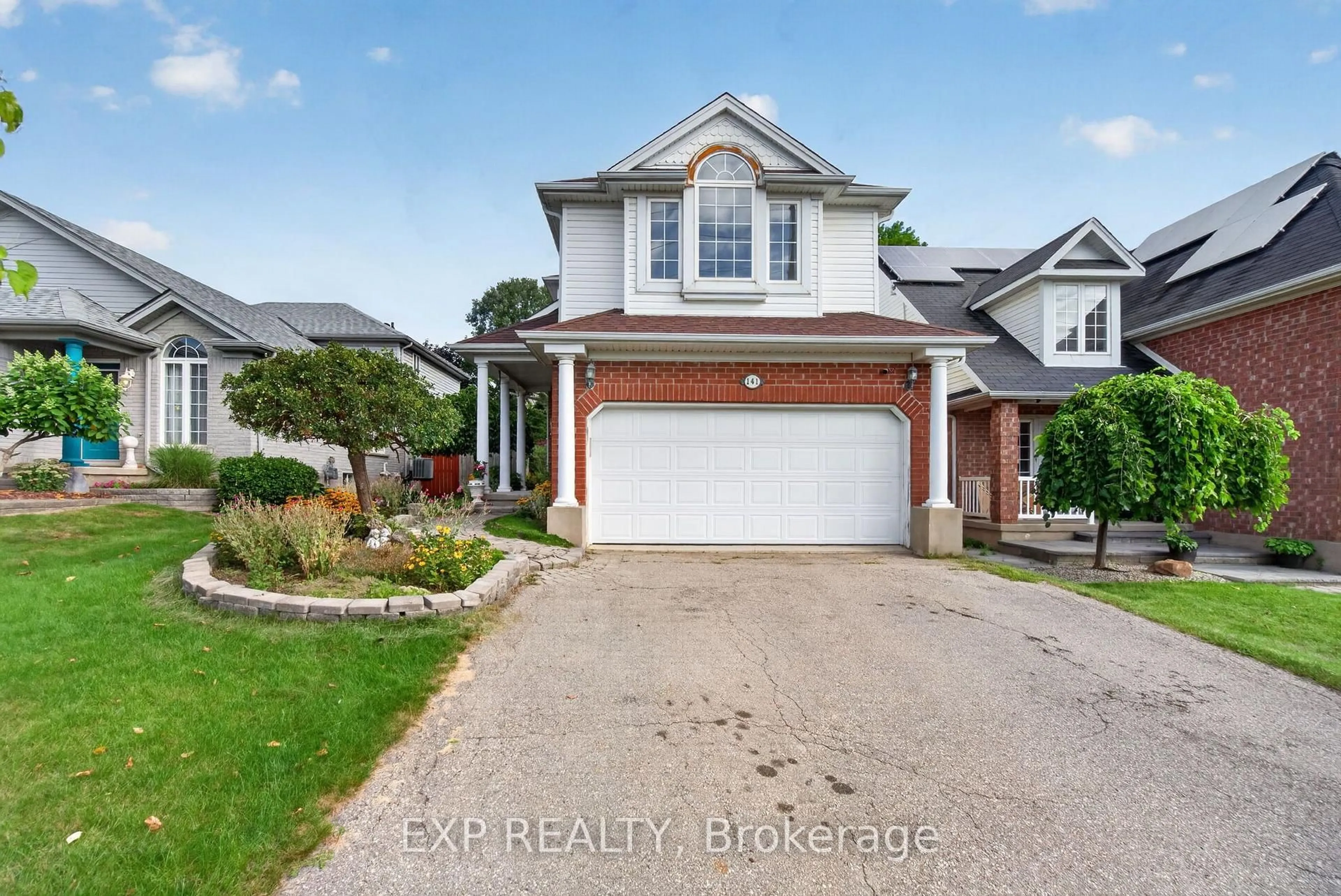 Home with brick exterior material, street for 141 Starwood Dr, Guelph Ontario N1E 7G7