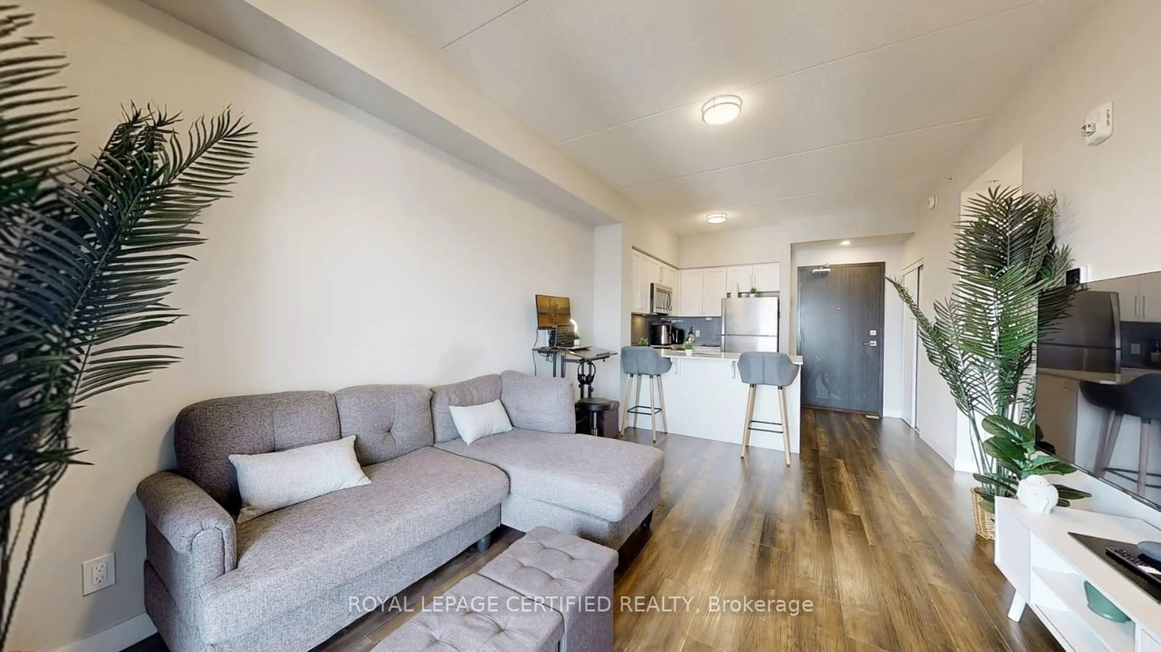 Living room with furniture, wood/laminate floor for 15 Queen St #1608, Hamilton Ontario L8P 0C6