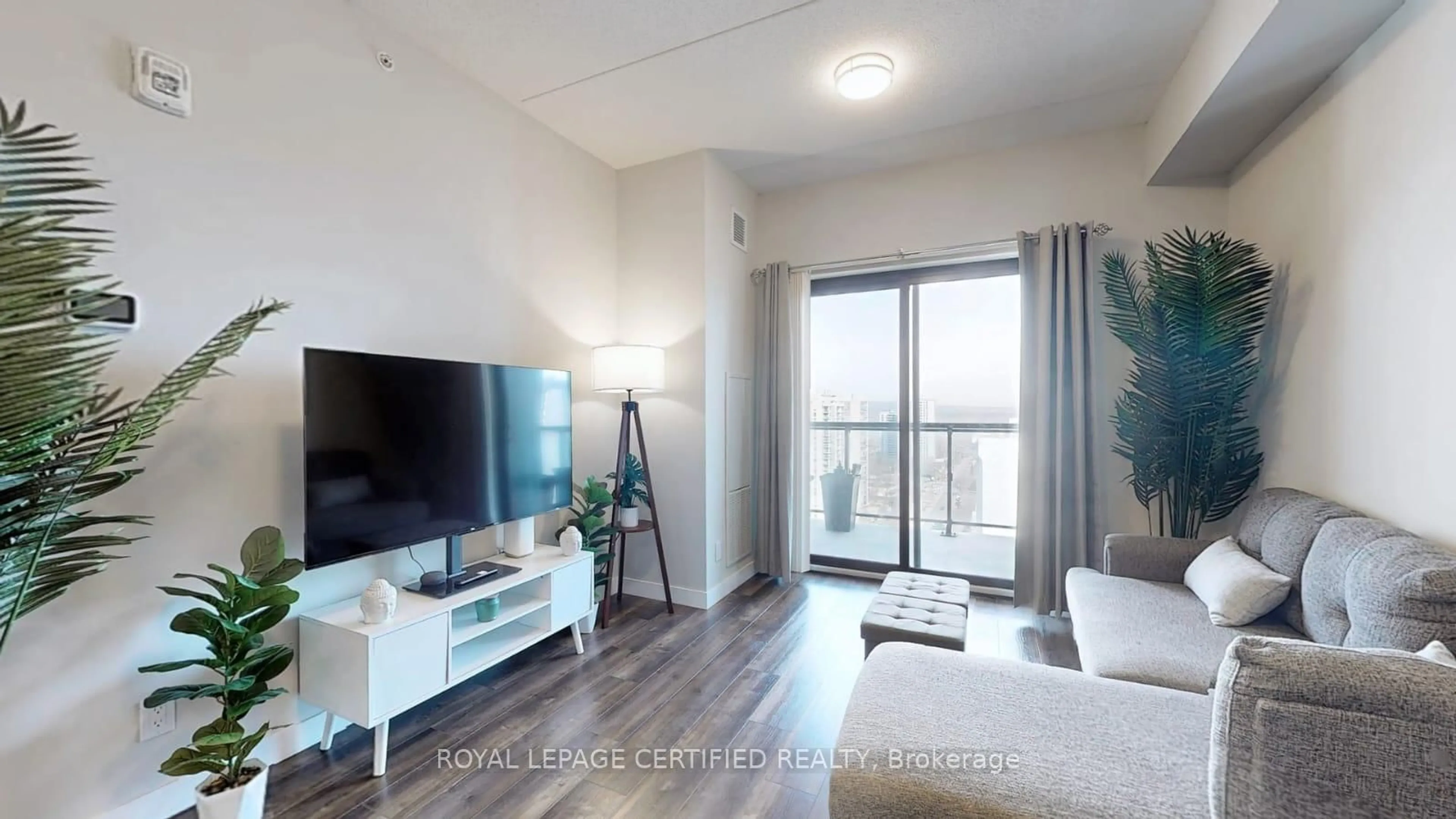 Living room with furniture, wood/laminate floor for 15 Queen St #1608, Hamilton Ontario L8P 0C6