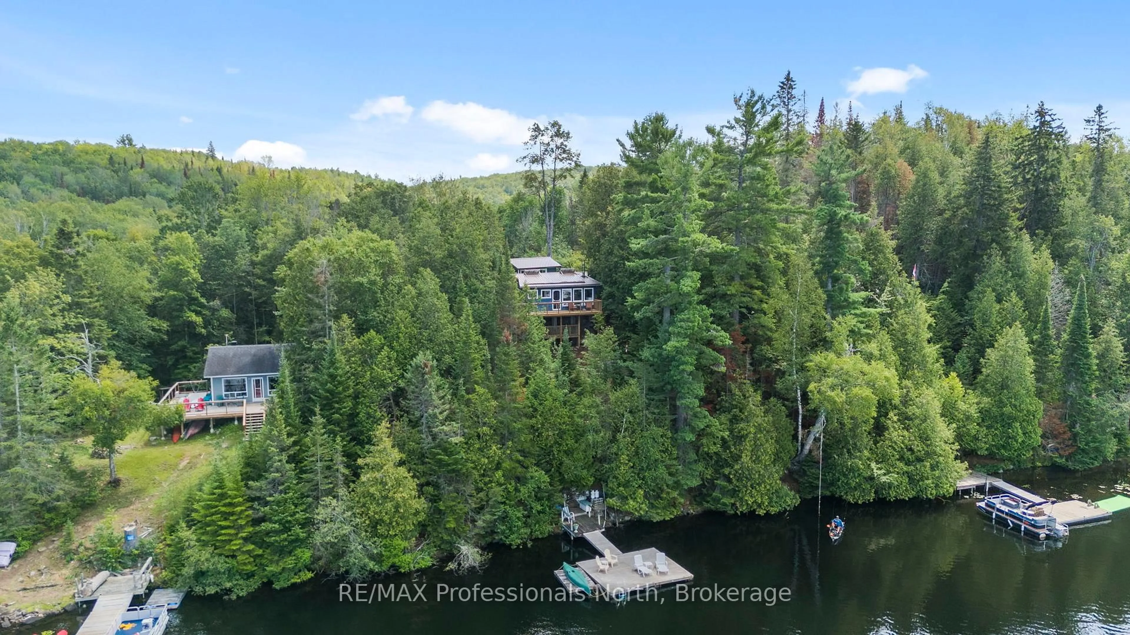 A pic from outside/outdoor area/front of a property/back of a property/a pic from drone, water/lake/river/ocean view for 10279 Cope Lake WAO, Highlands East Ontario K0L 2A0