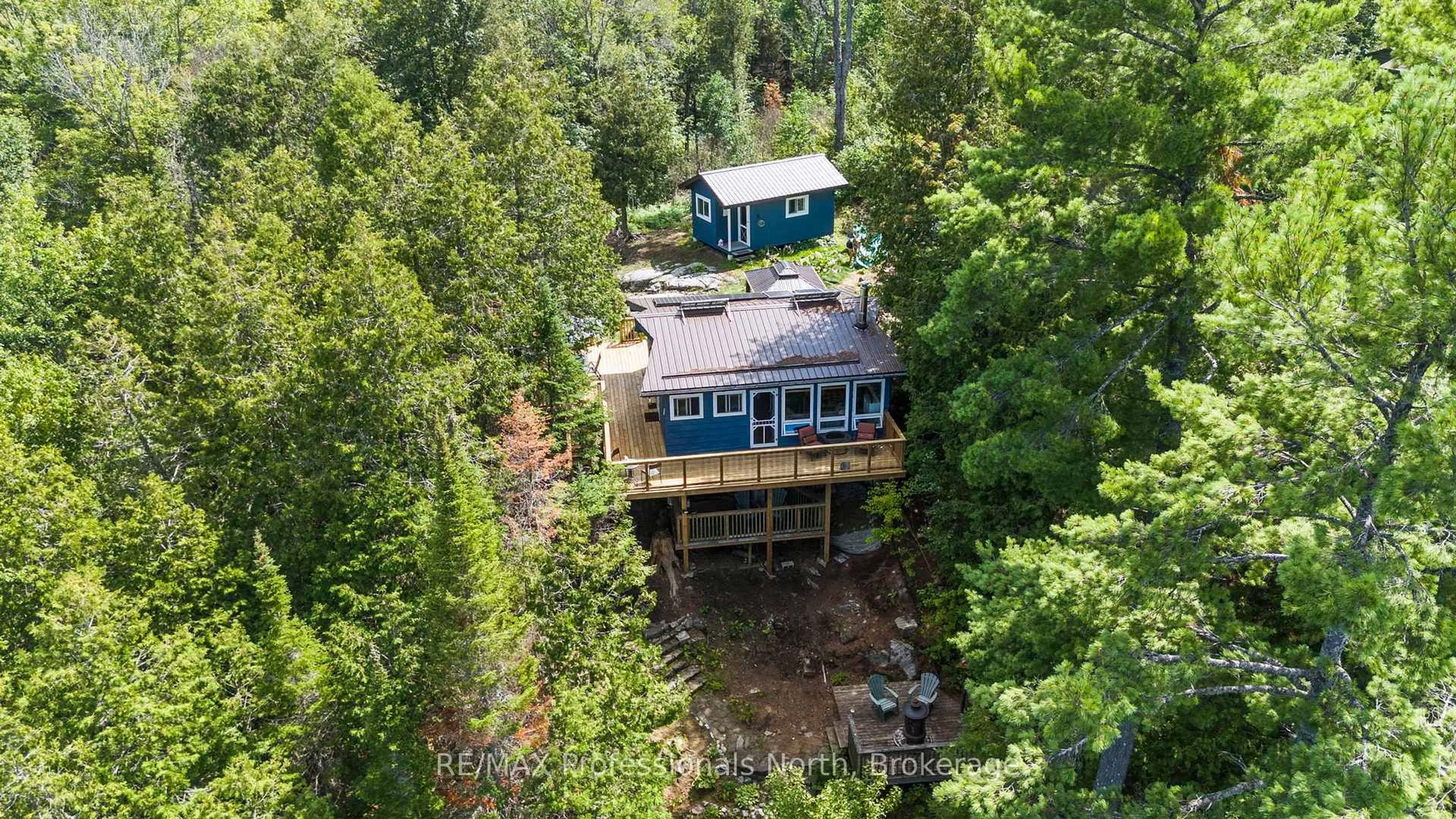 A pic from outside/outdoor area/front of a property/back of a property/a pic from drone, water/lake/river/ocean view for 10279 Cope Lake WAO, Highlands East Ontario K0L 2A0