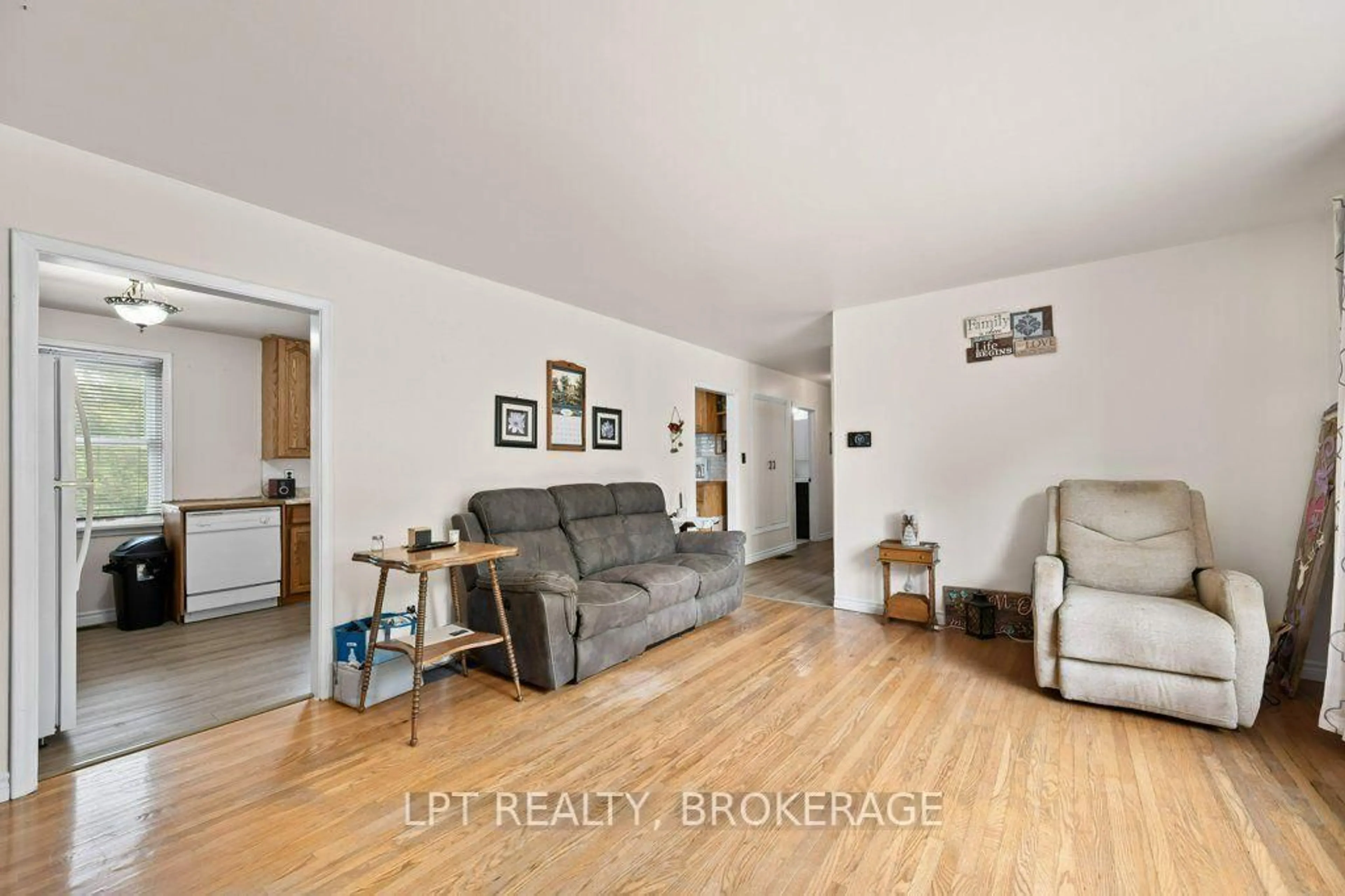 Living room with furniture, wood/laminate floor for 6175 Lakeview Dr, Verona Ontario K0H 2W0