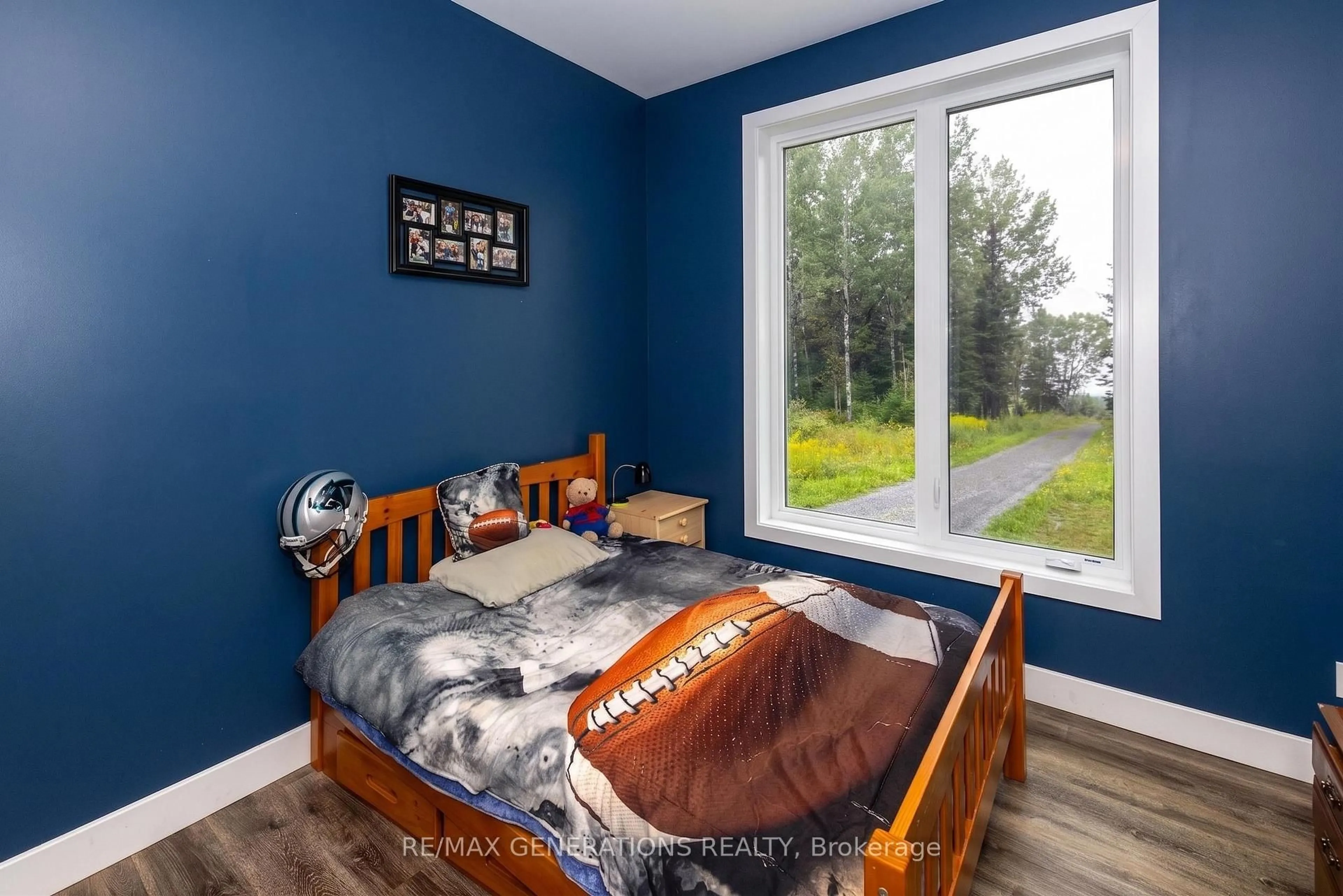 Bedroom with bed, wood/laminate floor for 24 Gillespie Rd, Oliver Paipoonge Ontario P7J 0E3