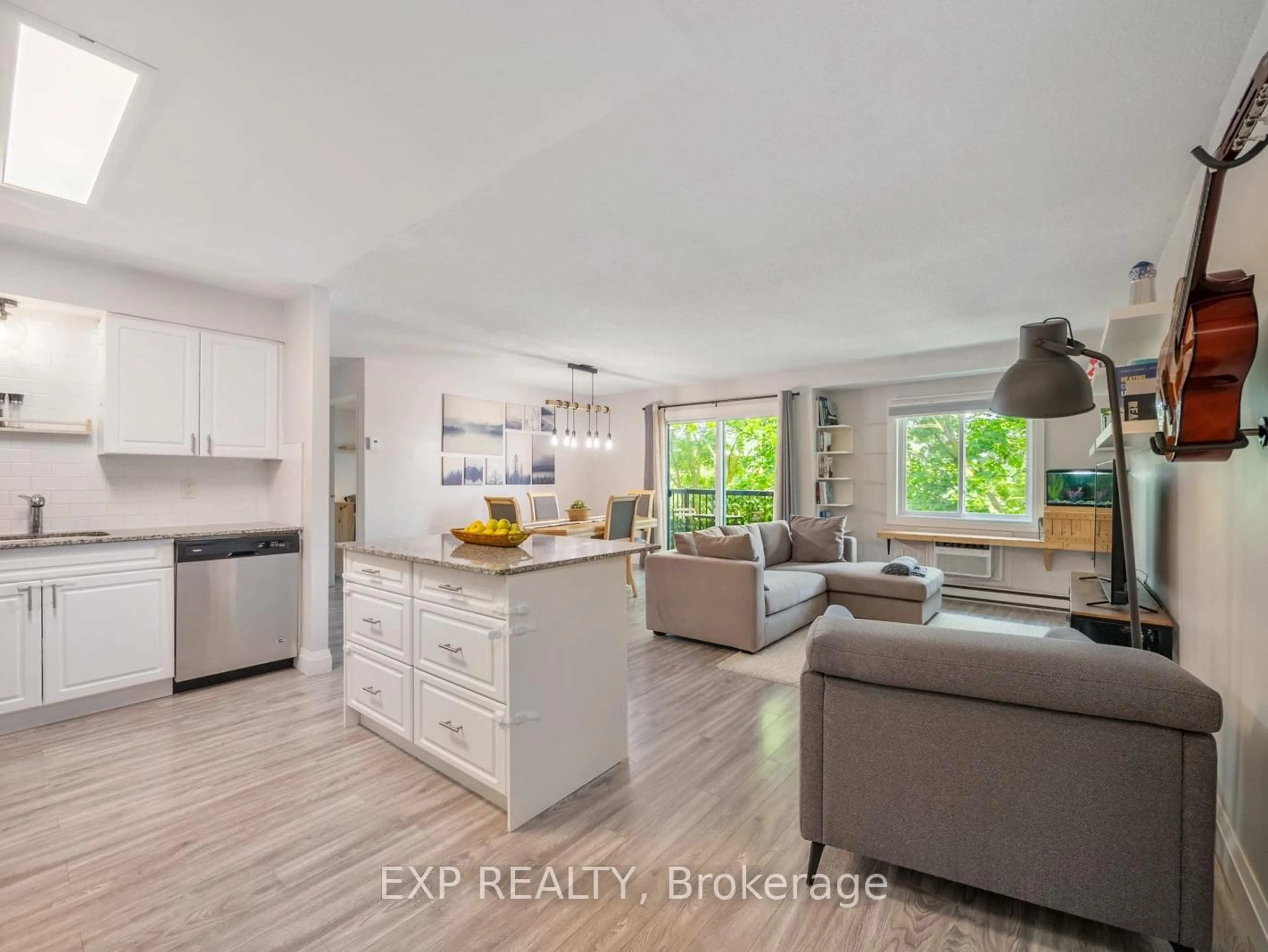 Open concept kitchen, wood/laminate floor for 276 Eiwo Crt #301, Waterloo Ontario N2K 3M6
