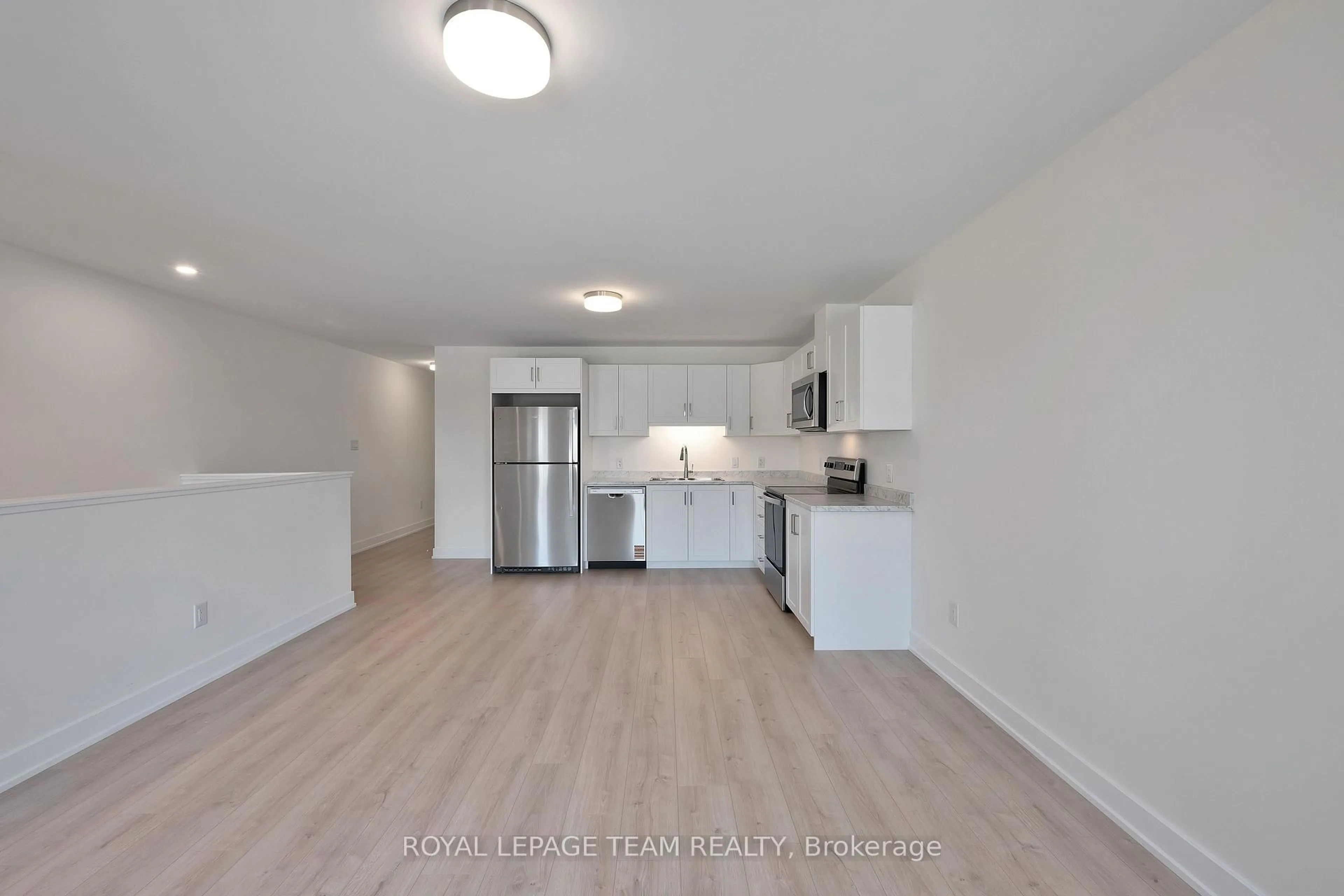 Open concept kitchen, wood/laminate floor for 142 Doctor Agnes Craine Dr, Smiths Falls Ontario K7A 0A5