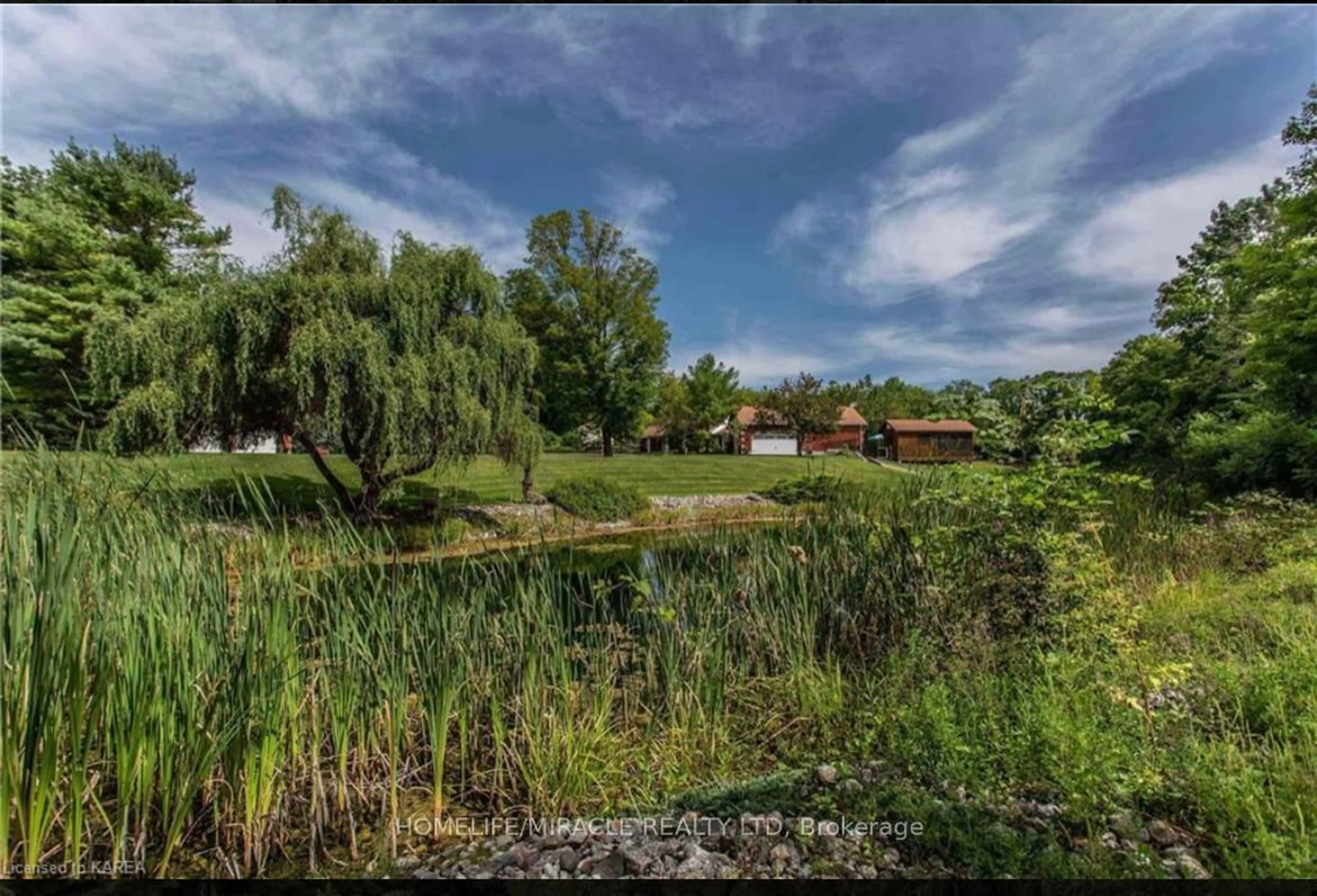A pic from outside/outdoor area/front of a property/back of a property/a pic from drone, water/lake/river/ocean view for 13382 Highway 38 Highway, Sharbot Lake Ontario K0H 2P0