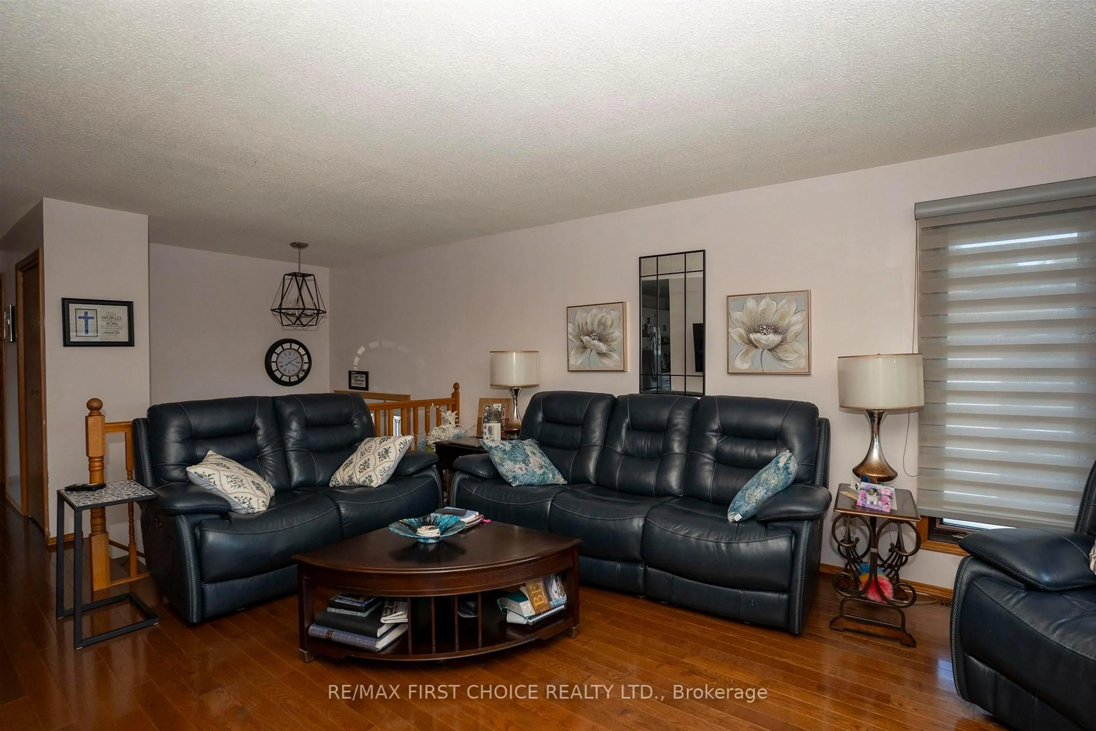 Living room with furniture, wood/laminate floor for 224 London Dr, Thunder Bay Ontario P7A 7Z6