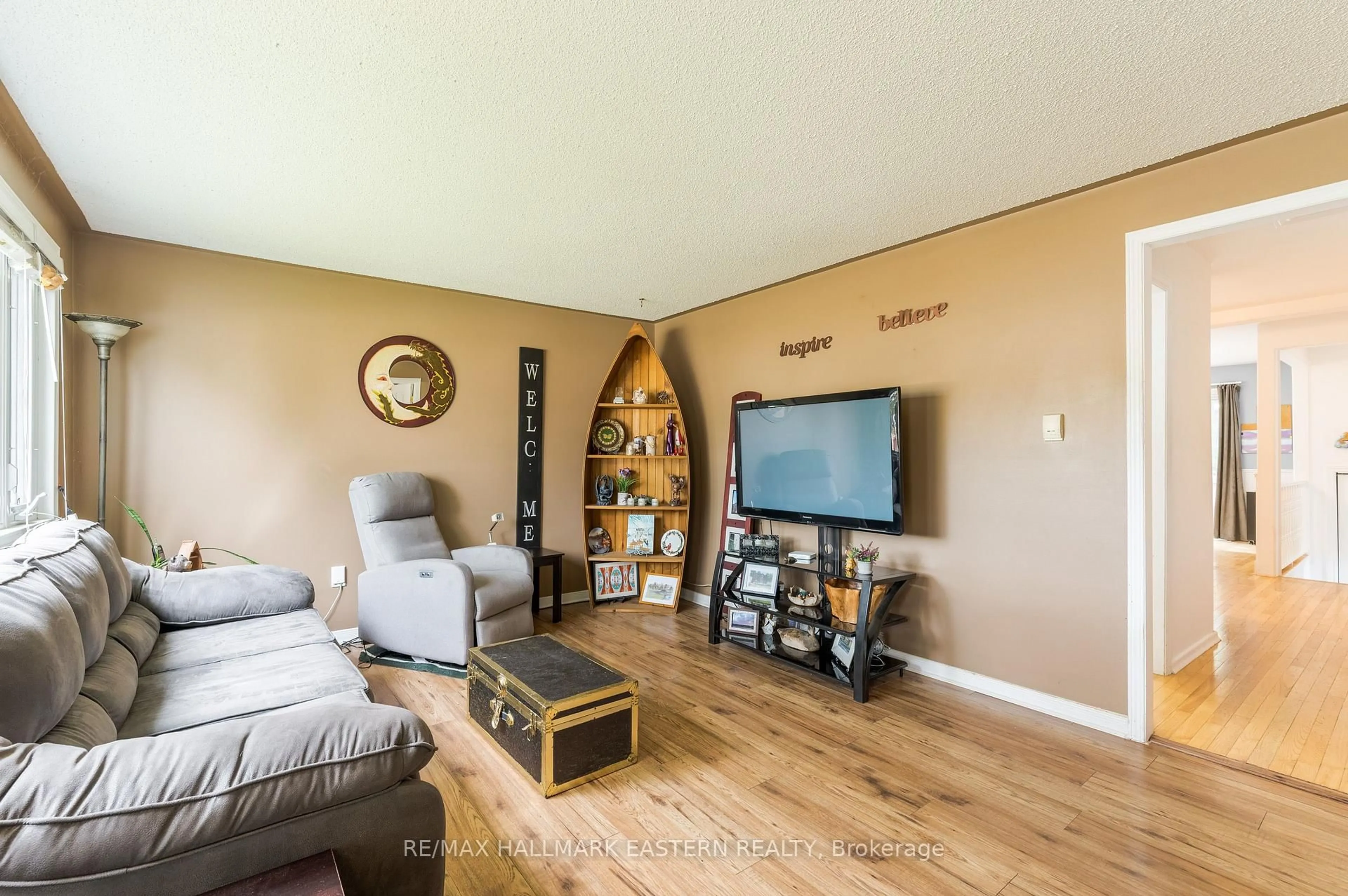 Living room with furniture, wood/laminate floor for 767 Duffus St, Peterborough Ontario K9J 4K3