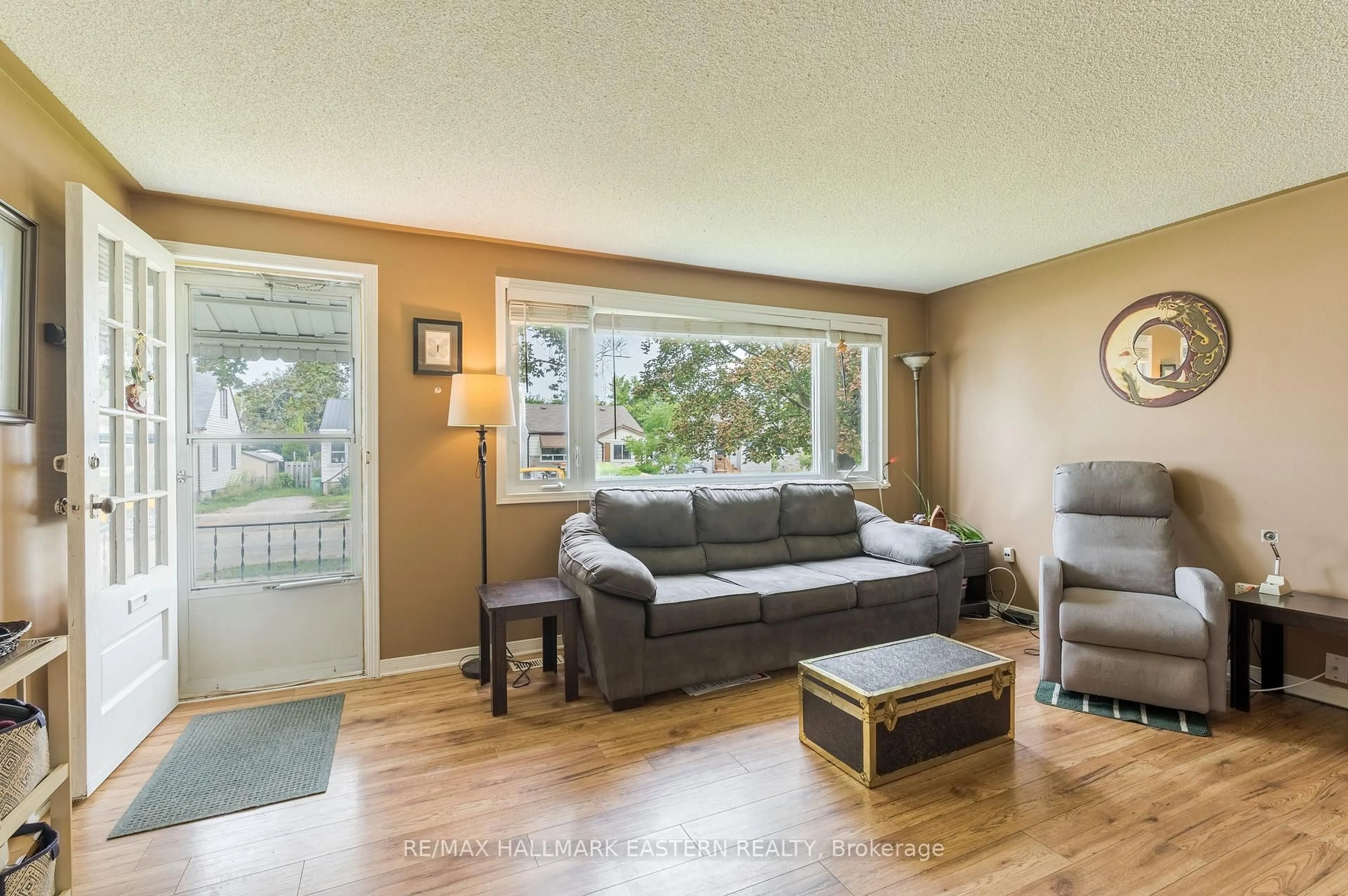 Living room with furniture, wood/laminate floor for 767 Duffus St, Peterborough Ontario K9J 4K3
