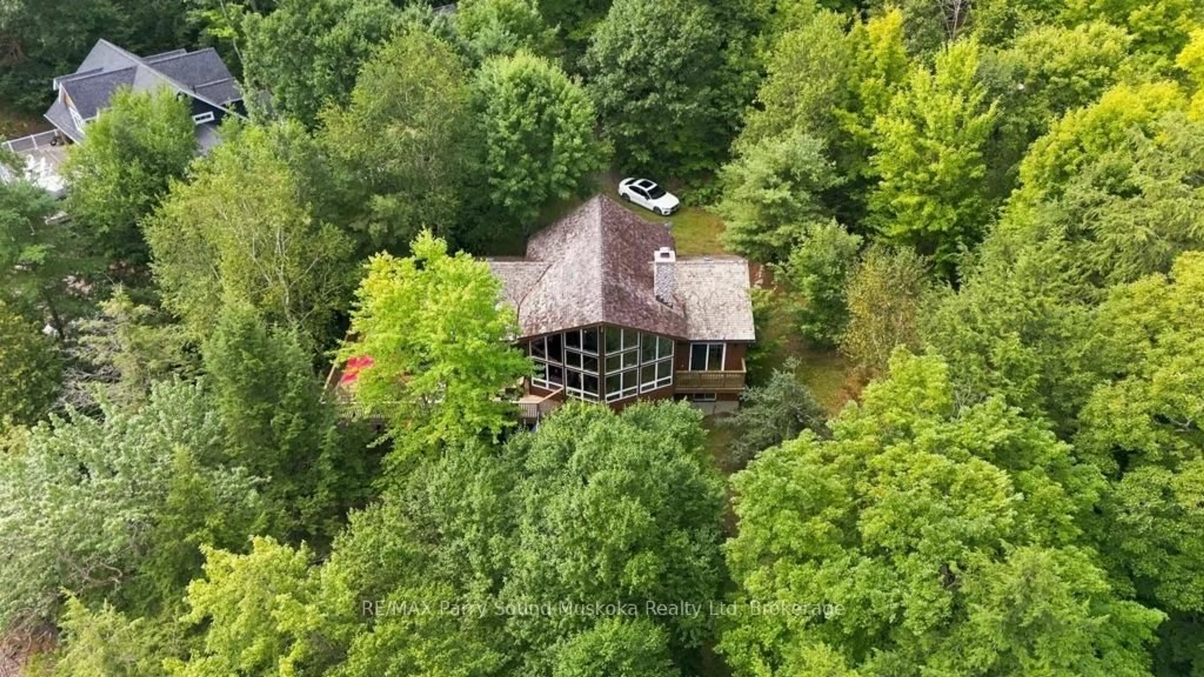 A pic from outside/outdoor area/front of a property/back of a property/a pic from drone, forest/trees view for 31 Lyndsey Lane, McKellar Ontario P2A 0B5