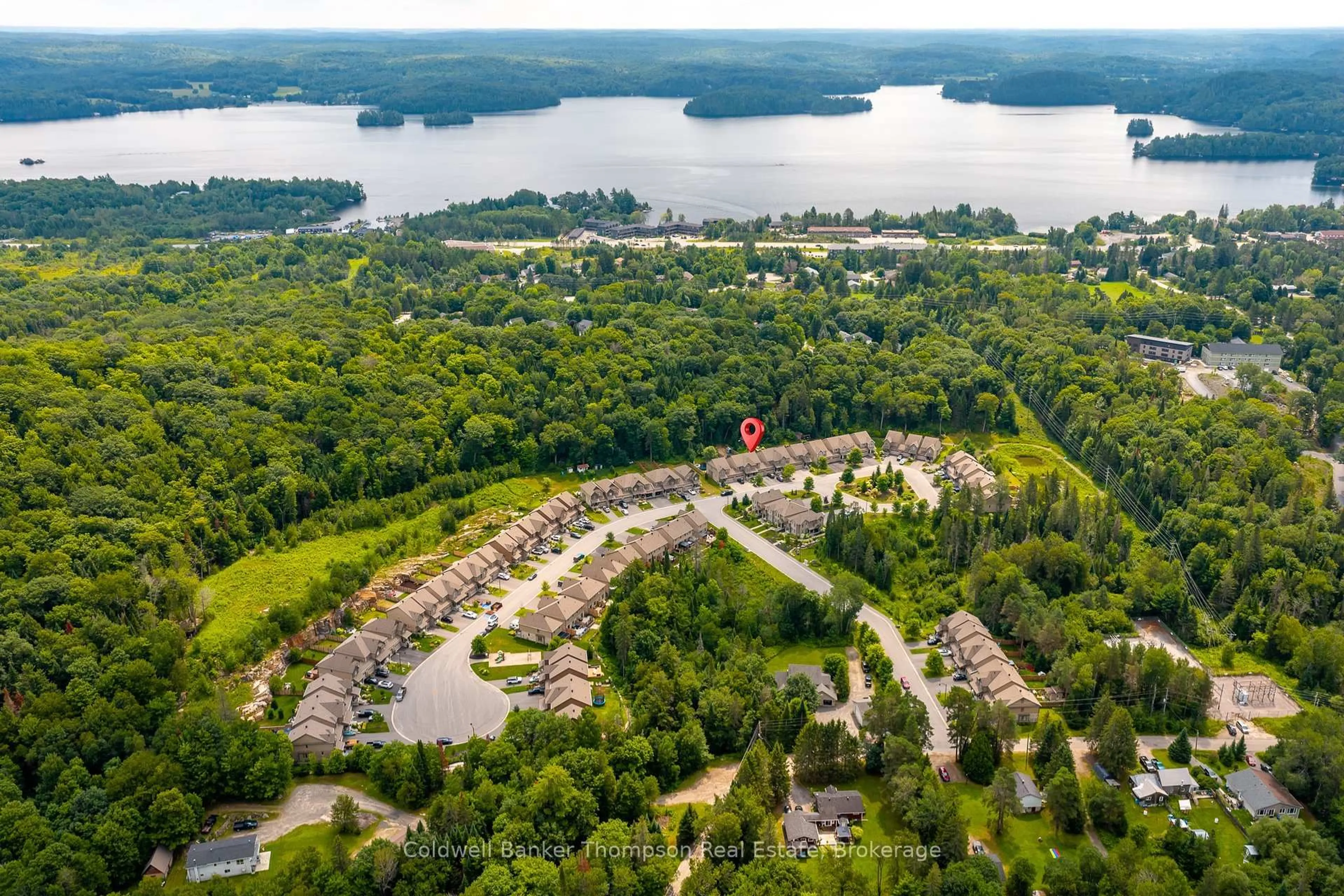 A pic from outside/outdoor area/front of a property/back of a property/a pic from drone, water/lake/river/ocean view for 12 Spalding Cres, Huntsville Ontario P1H 1C9