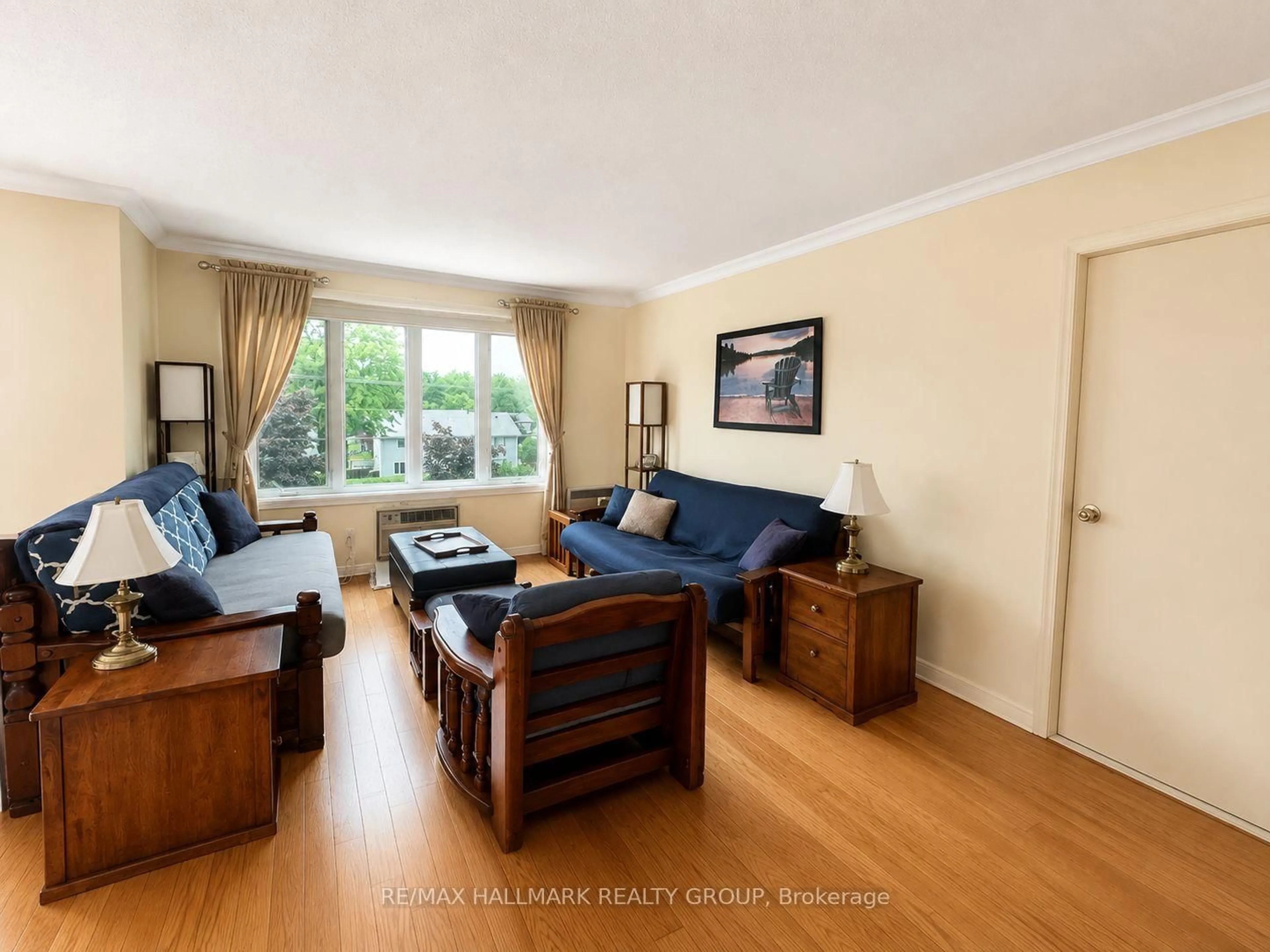 Living room with furniture, wood/laminate floor for 669 Spence Ave #6, Hawkesbury Ontario K6A 3S2