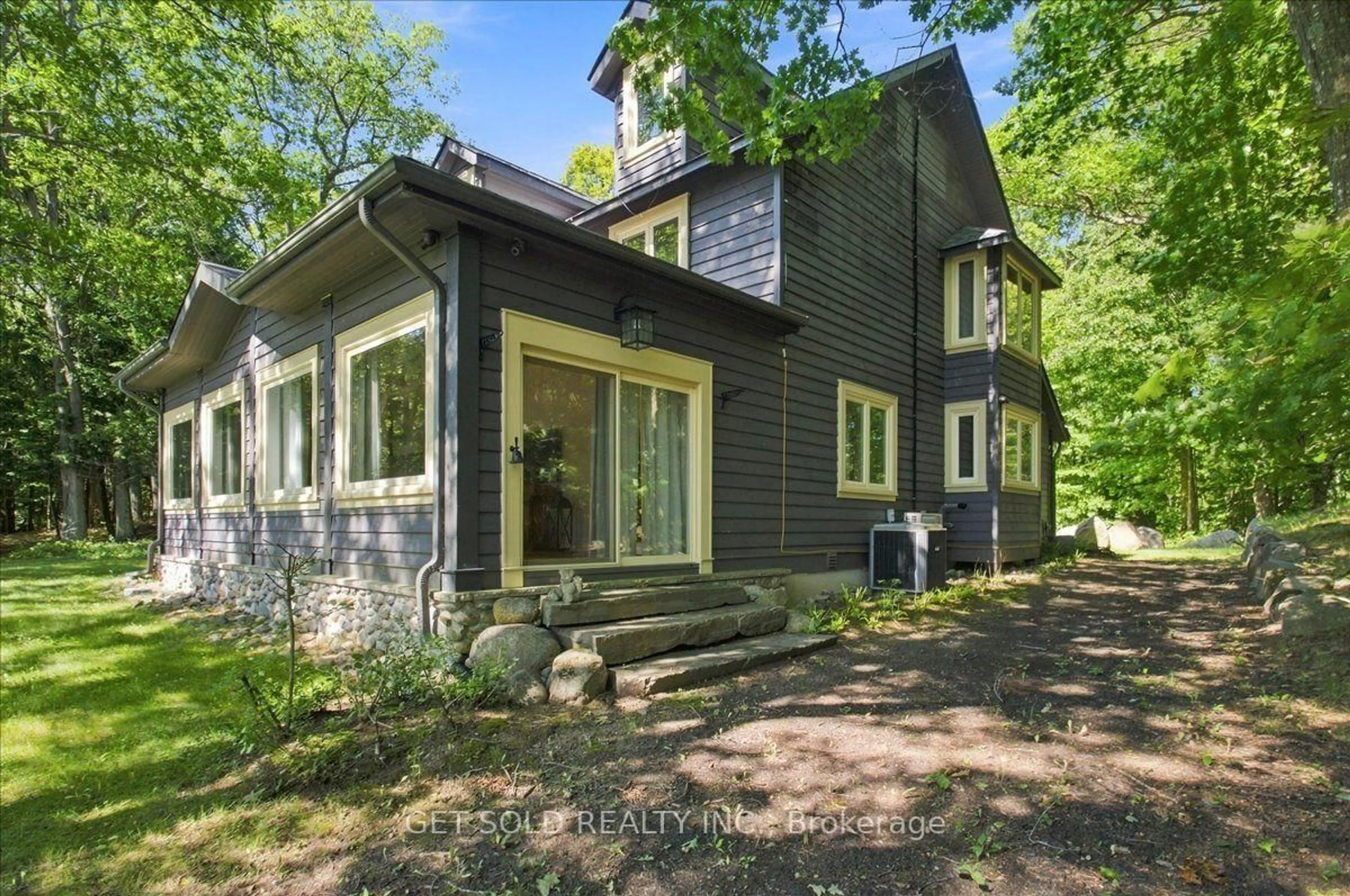 Home with brick exterior material, street for 2045 Muskoka Rd #118 W Unit 2, Muskoka Lakes Ontario P1L 1W8