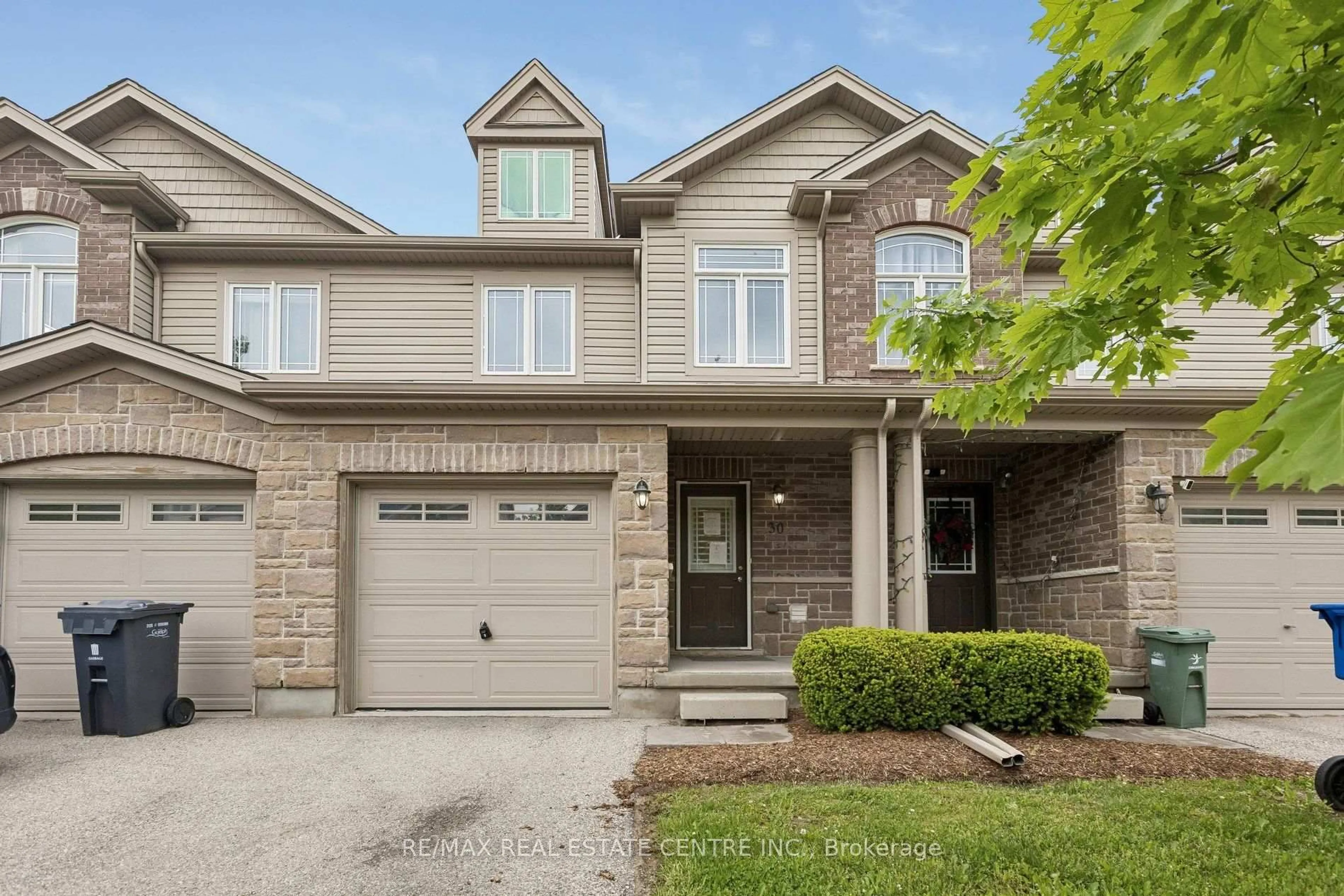 Home with brick exterior material, street for 30 Oldfield Dr #30O, Guelph Ontario N1L 0K7