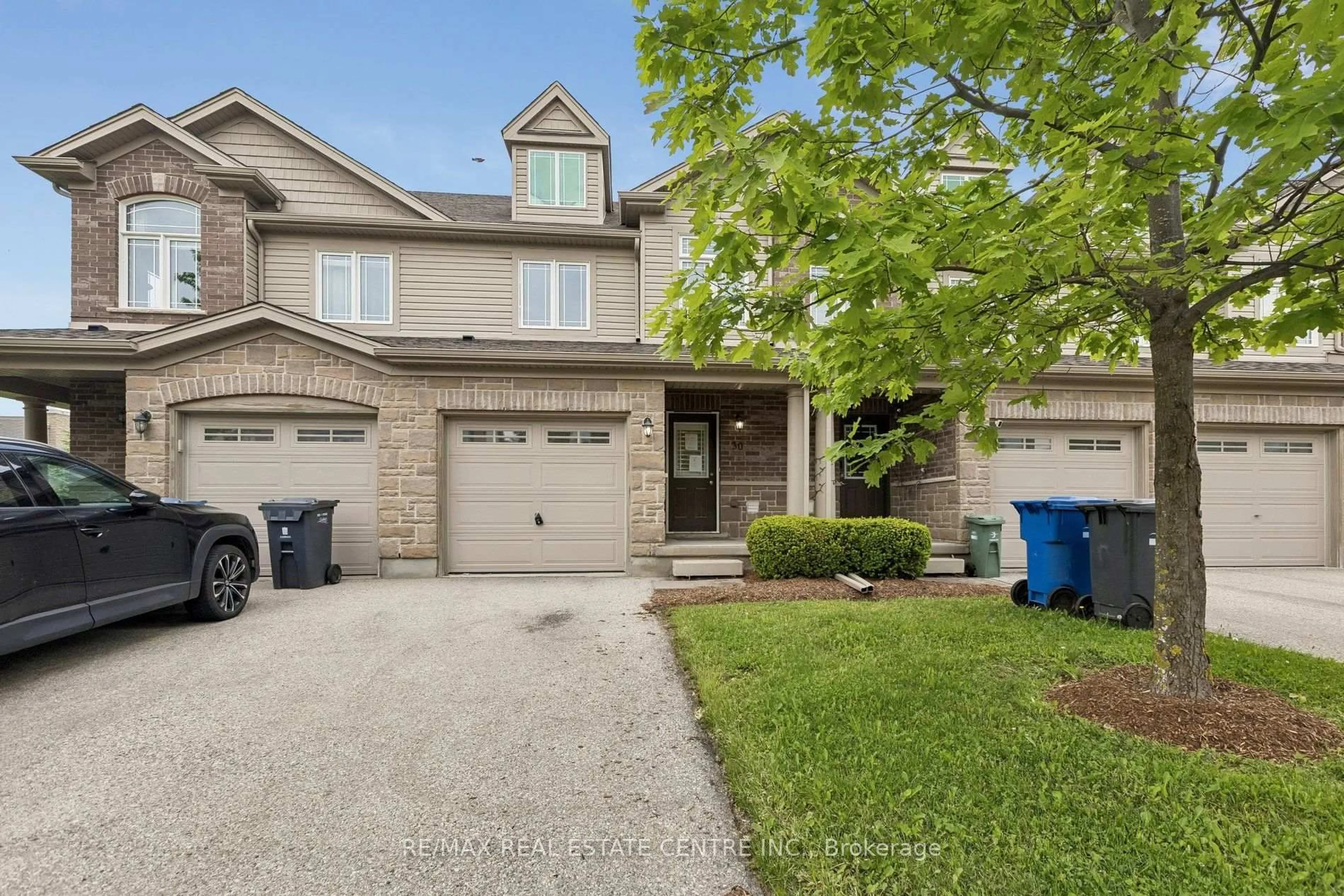 Home with brick exterior material, street for 30 Oldfield Dr #30O, Guelph Ontario N1L 0K7