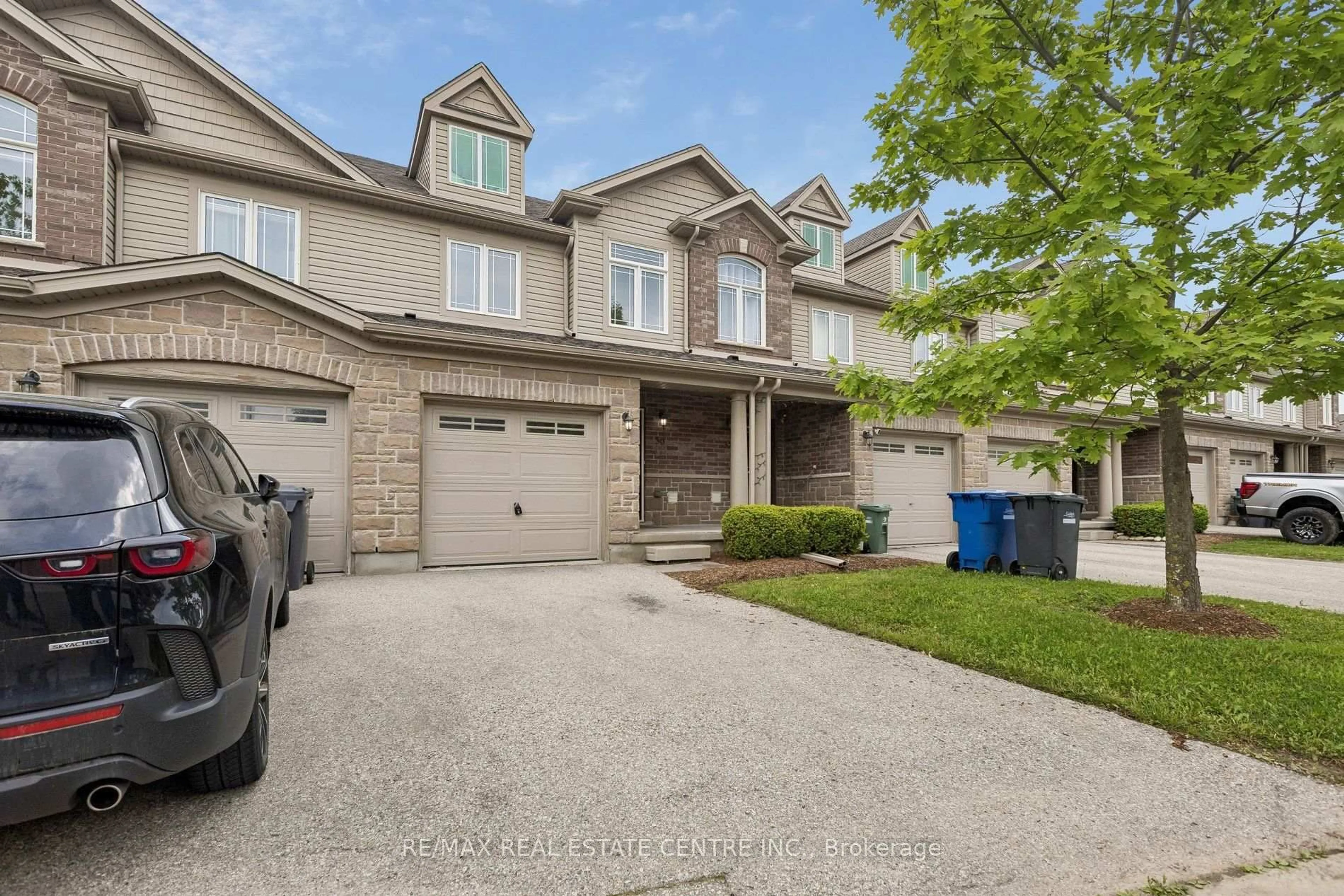 A pic from outside/outdoor area/front of a property/back of a property/a pic from drone, street for 30 Oldfield Dr #30O, Guelph Ontario N1L 0K7