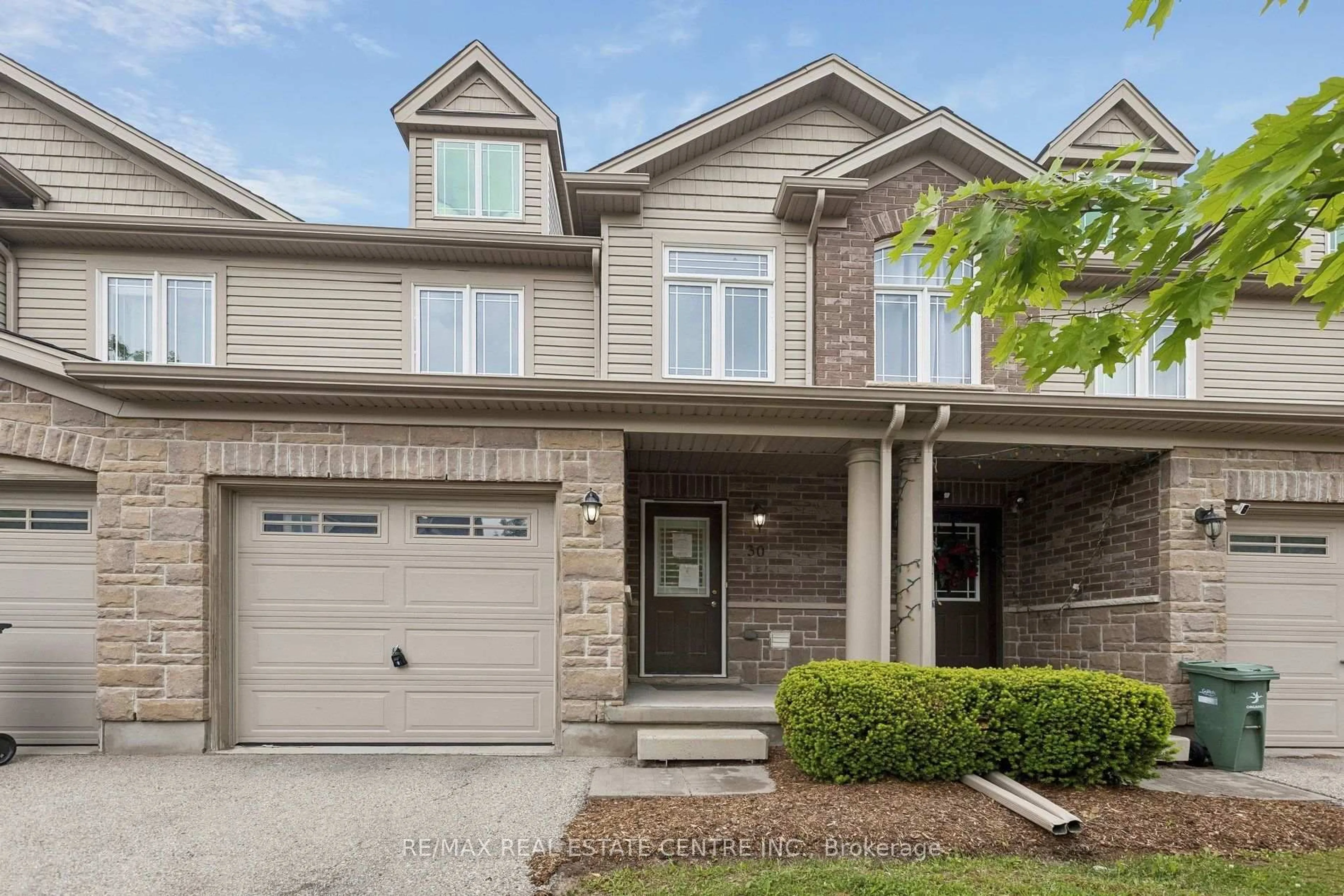 Home with brick exterior material, street for 30 Oldfield Dr #30O, Guelph Ontario N1L 0K7