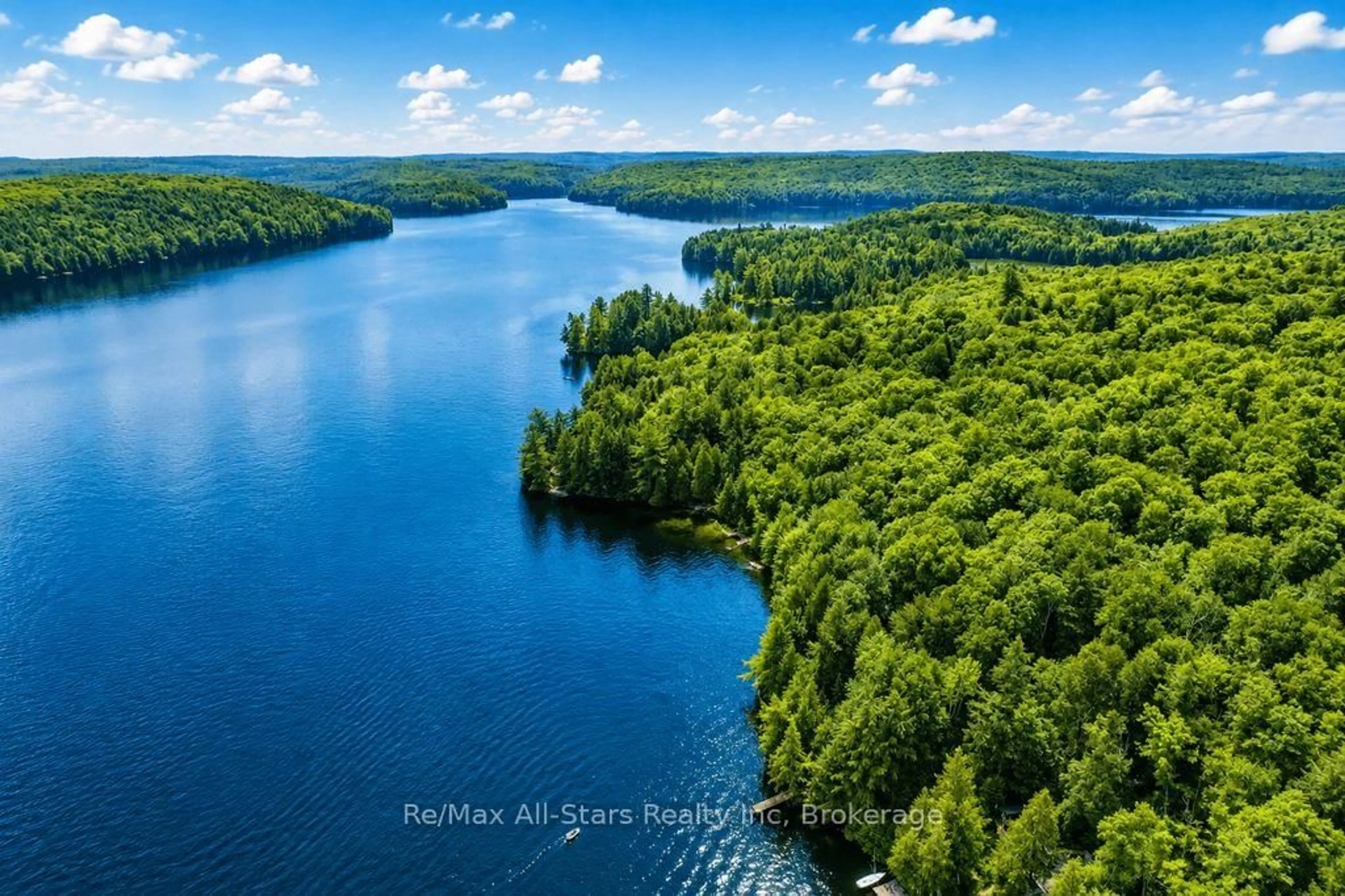 A pic from outside/outdoor area/front of a property/back of a property/a pic from drone, water/lake/river/ocean view for 1142 Smoke Lake, South Algonquin Ontario P0A 1H0