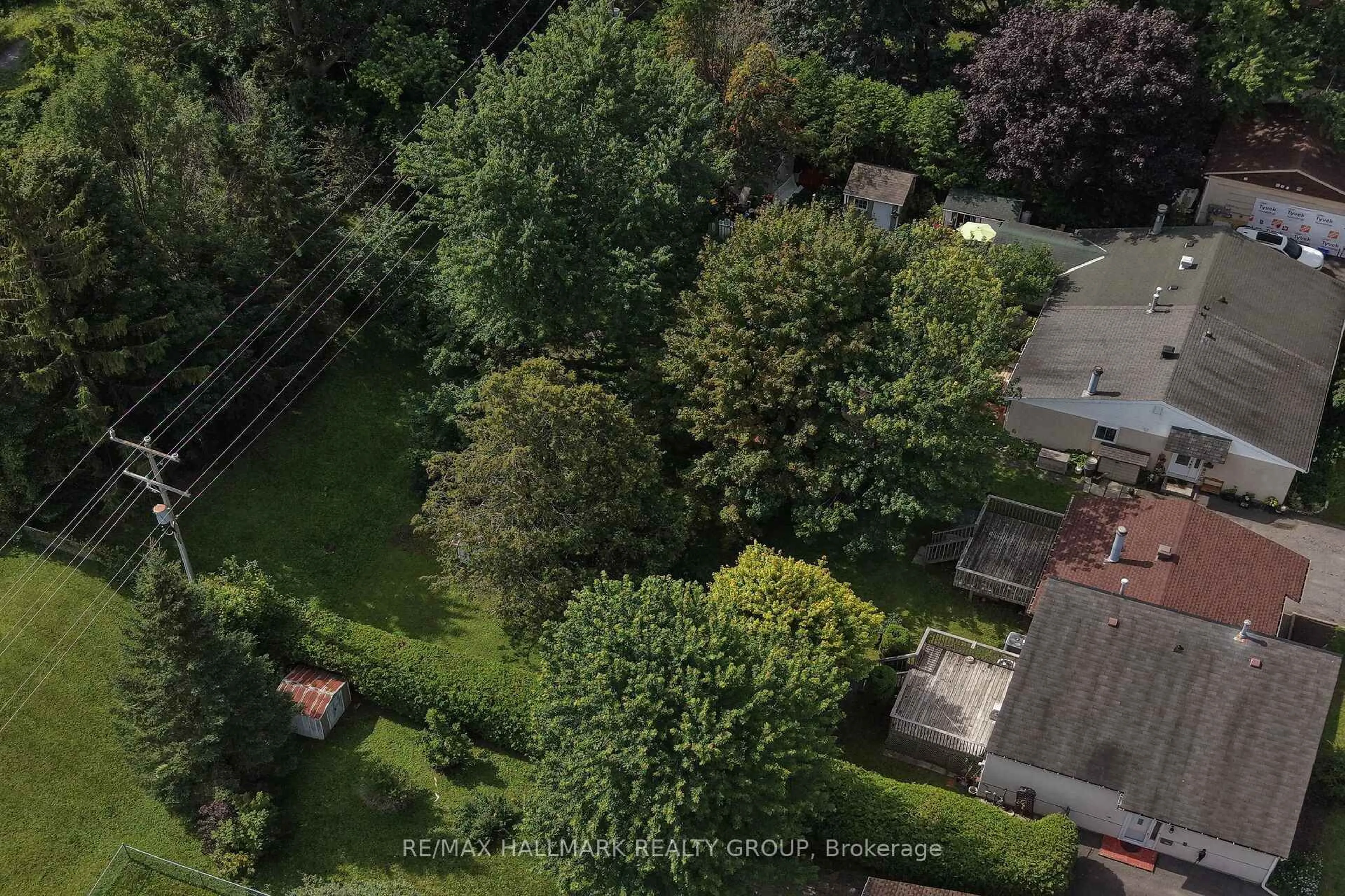 A pic from outside/outdoor area/front of a property/back of a property/a pic from drone, forest/trees view for 140 Rothesay Dr, Ottawa Ontario K2L 1P1