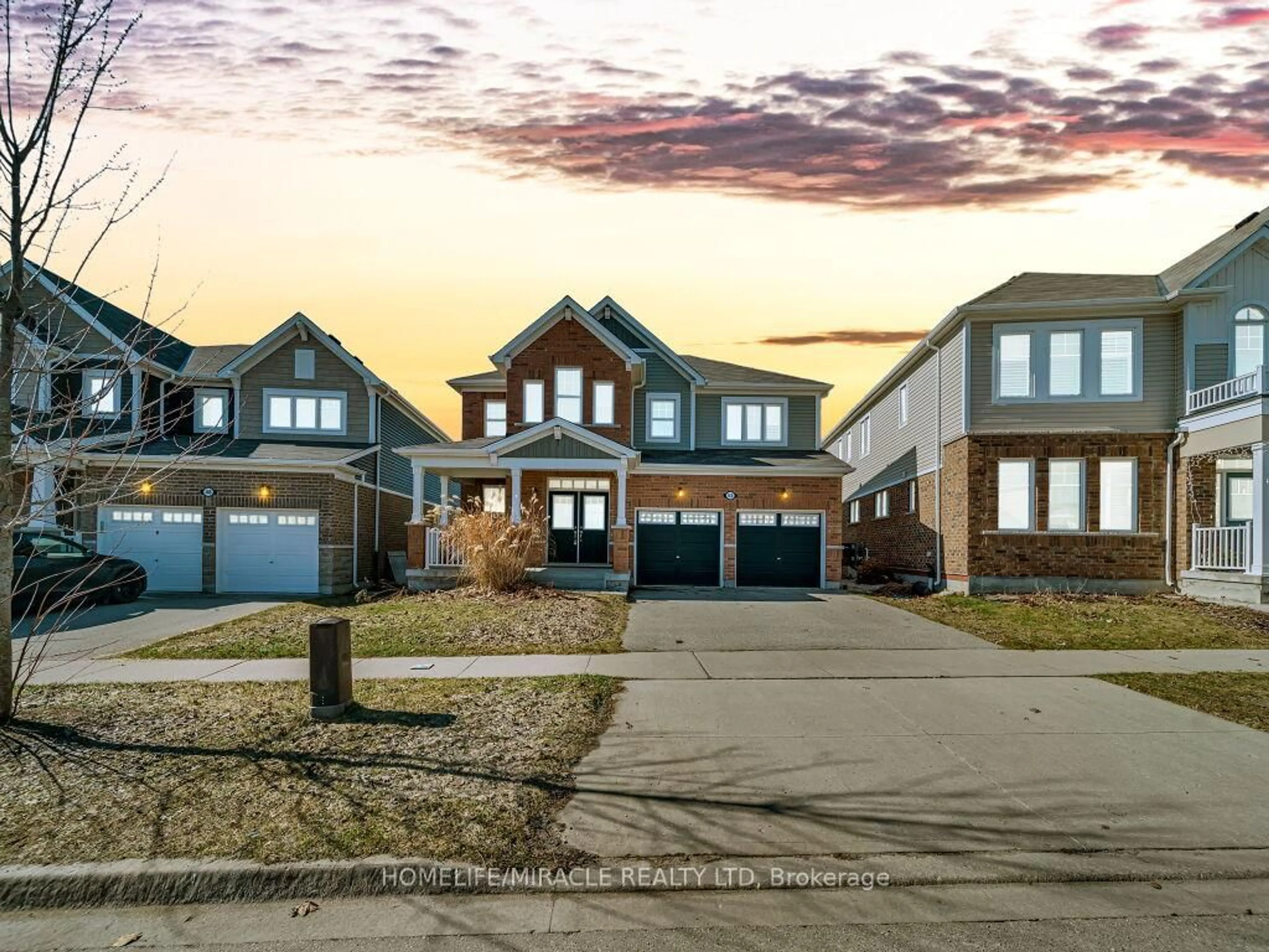 Home with brick exterior material, street for 52 Compass Tr, Cambridge Ontario N3E 0B7