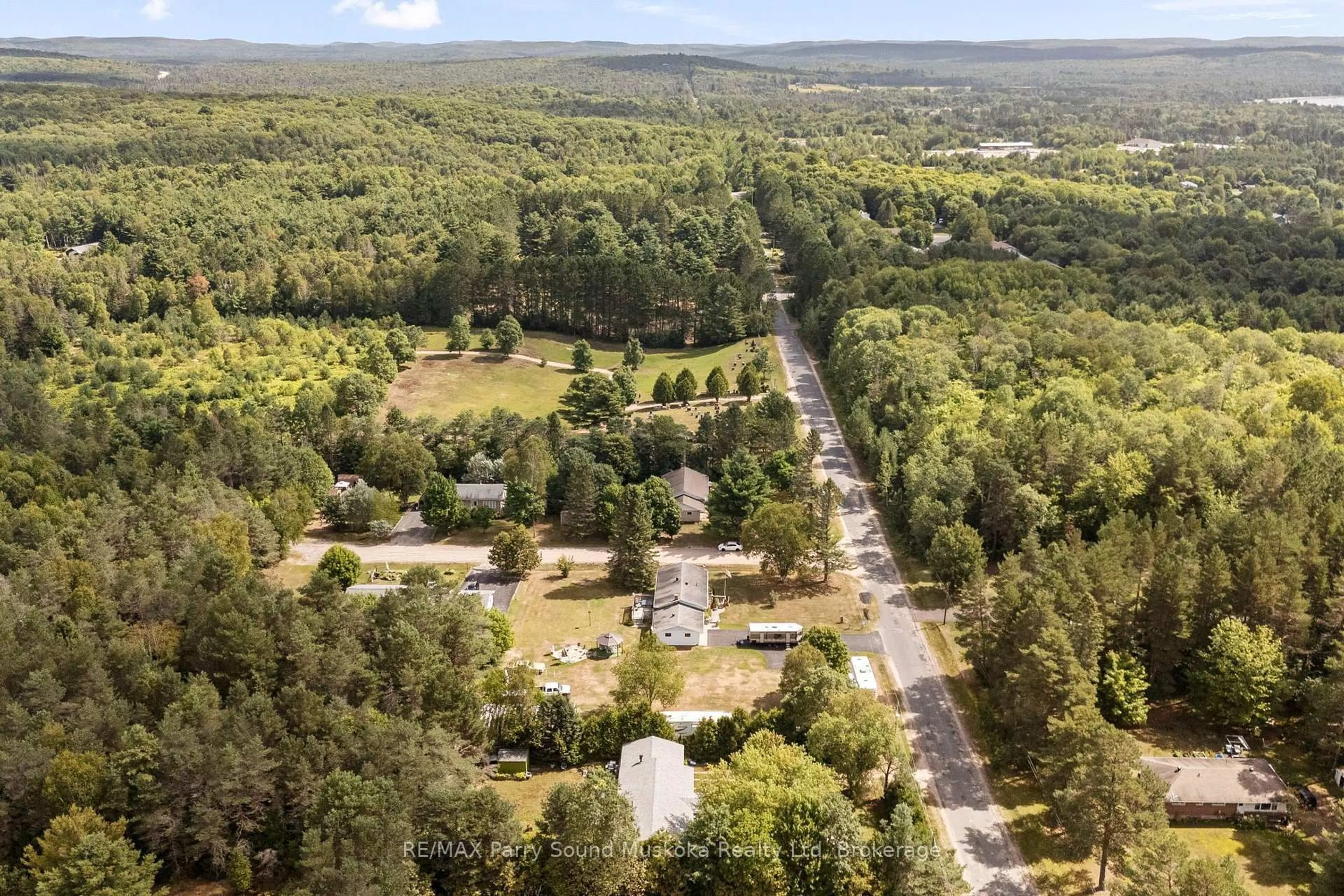 A pic from outside/outdoor area/front of a property/back of a property/a pic from drone, forest/trees view for 440 High St, Sundridge Ontario P0A 1Z0