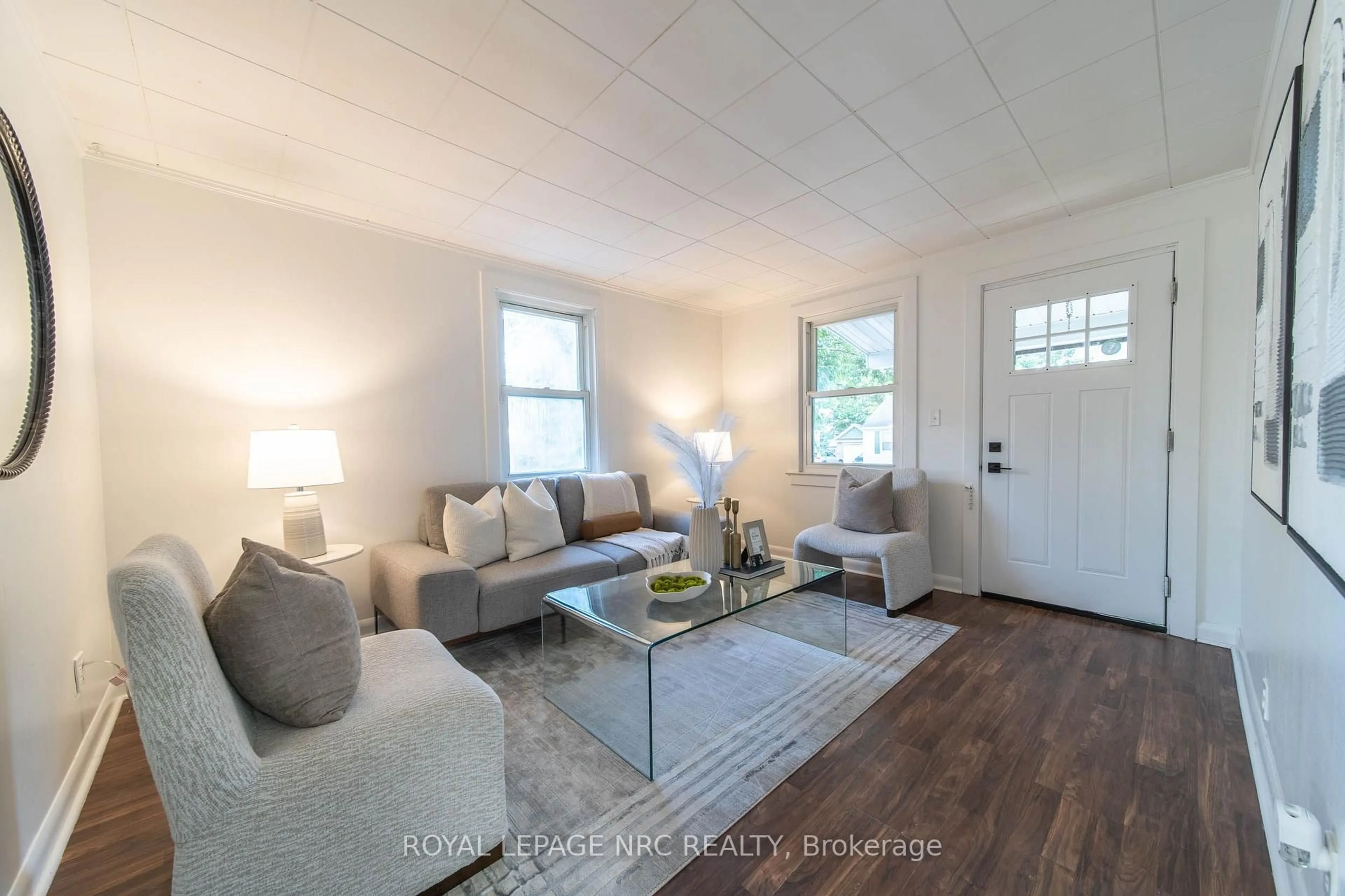 Living room with furniture, wood/laminate floor for 6255 Culp St, Niagara Falls Ontario L2G 2C2