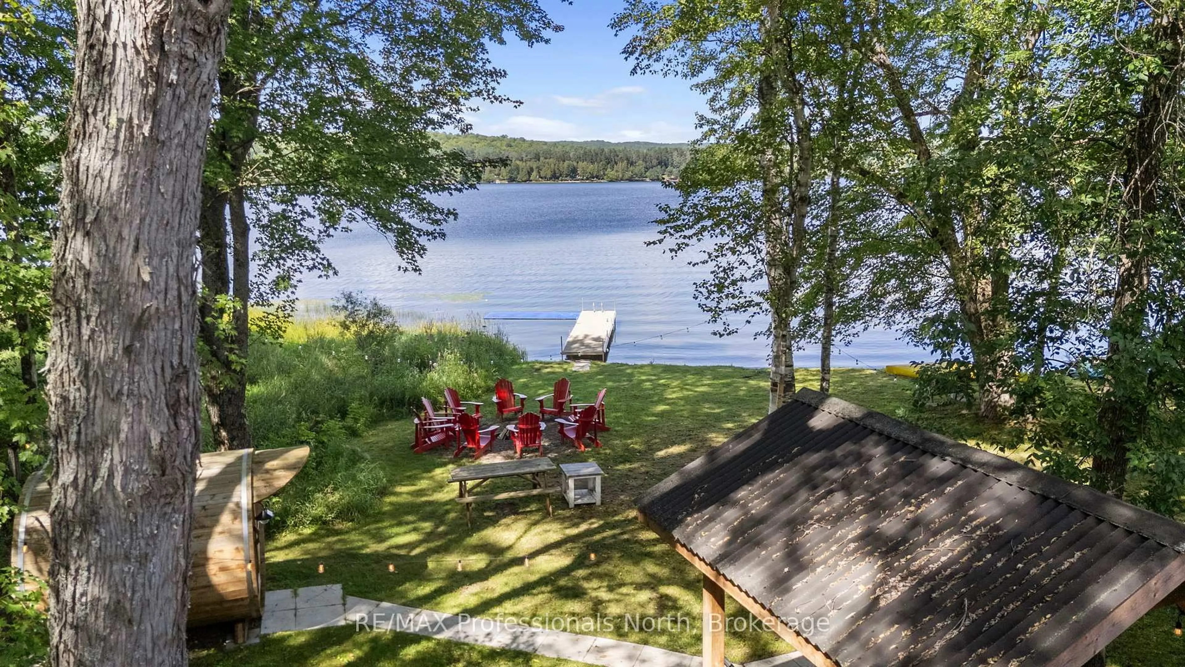 A pic from outside/outdoor area/front of a property/back of a property/a pic from drone, water/lake/river/ocean view for 11357 Highway 118, Dysart et al Ontario K0M 1S0