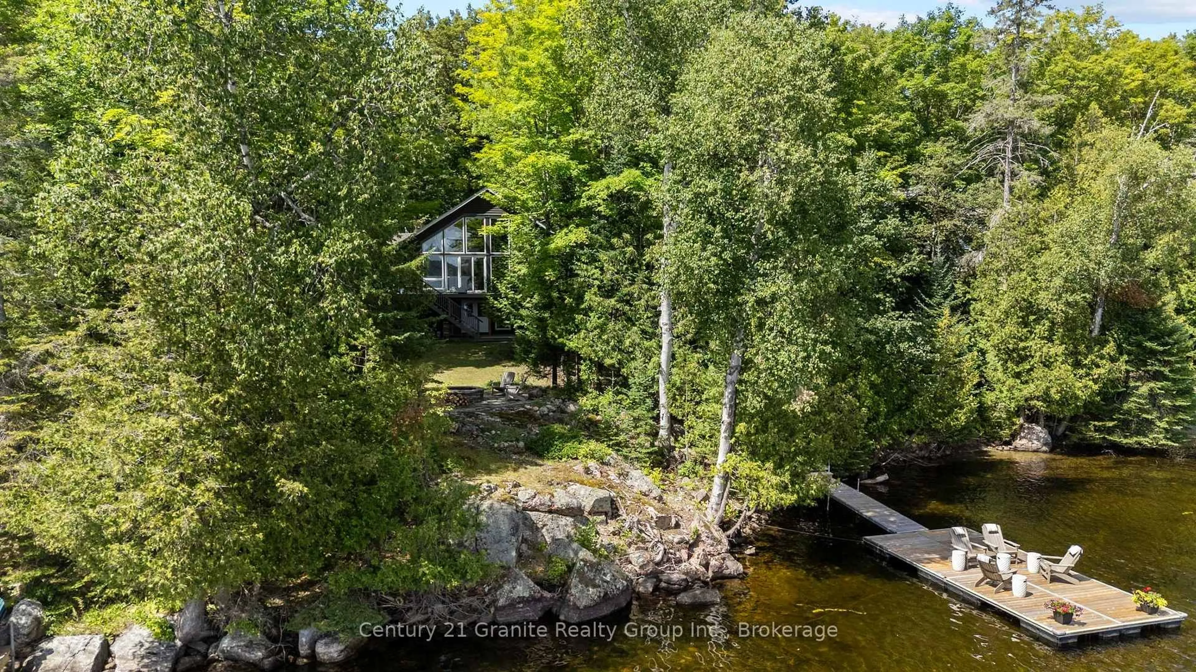 A pic from outside/outdoor area/front of a property/back of a property/a pic from drone, water/lake/river/ocean view for 1057 Hidden Valley Lane, Minden Hills Ontario K0M 2K0