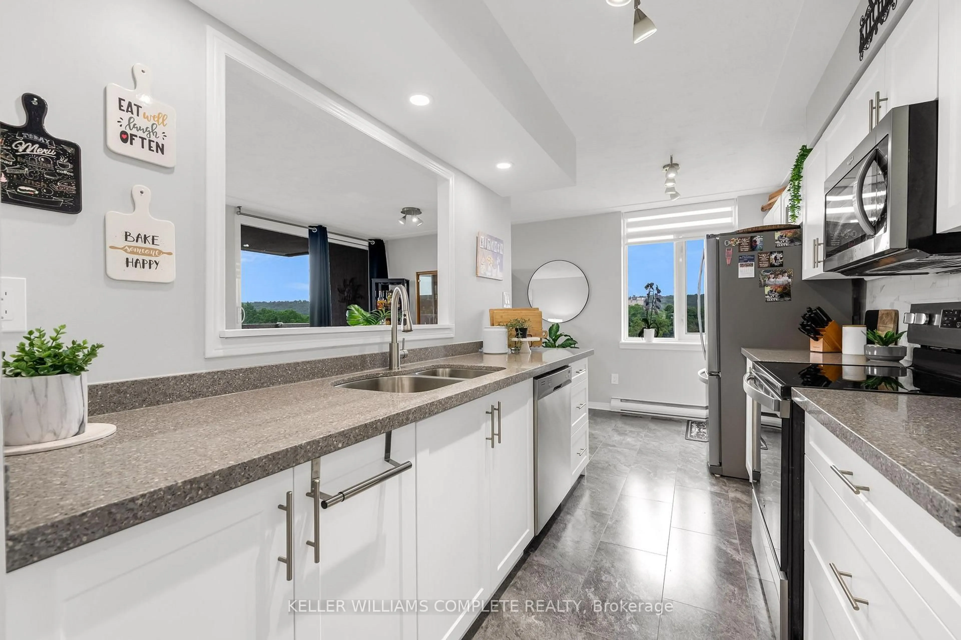 Open concept kitchen, ceramic/tile floor for 40 HARRISFORD St #608, Hamilton Ontario L8K 6N1