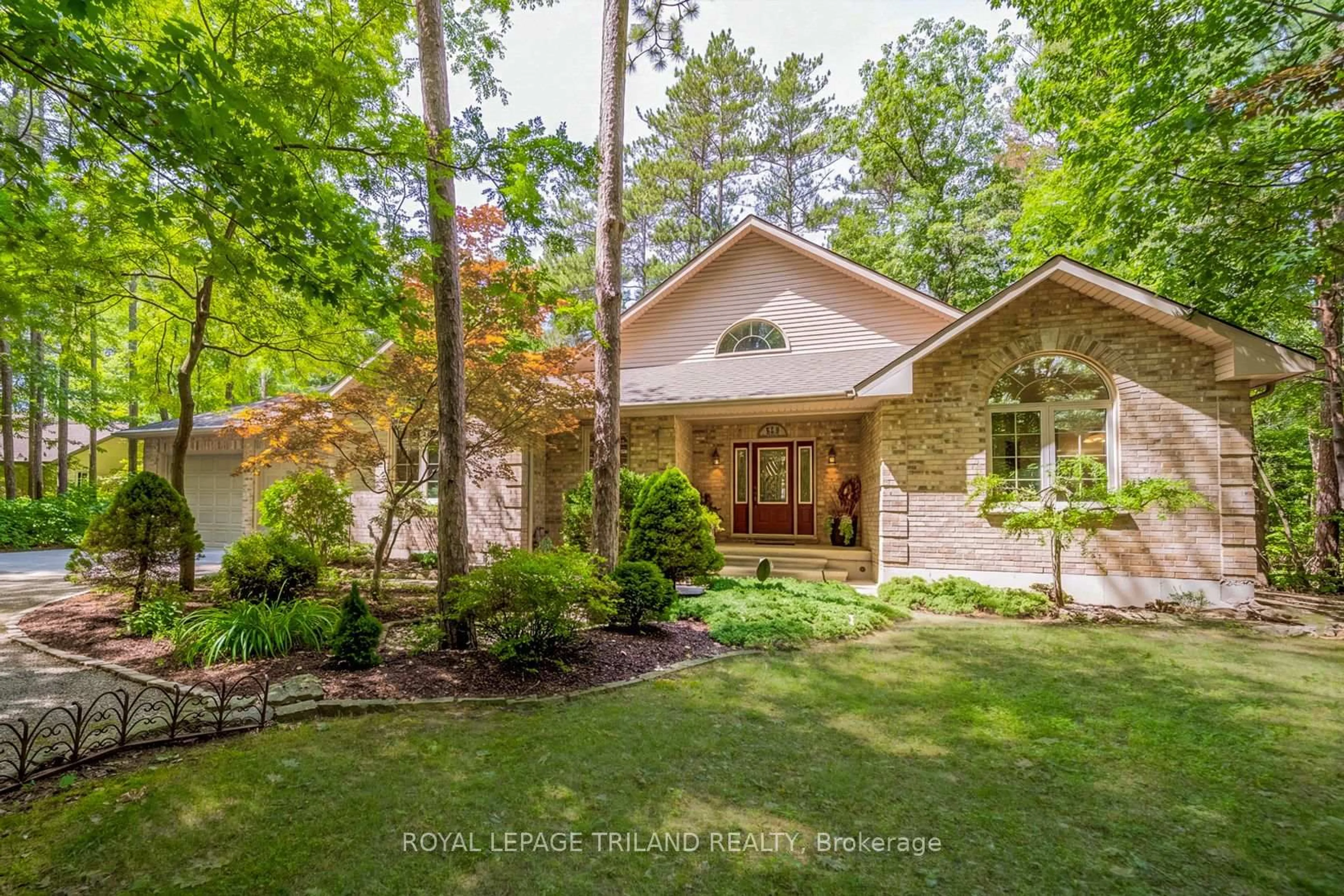 Home with brick exterior material, forest/trees view for 9958 Riverview Rd, Lambton Shores Ontario N0M 1T0
