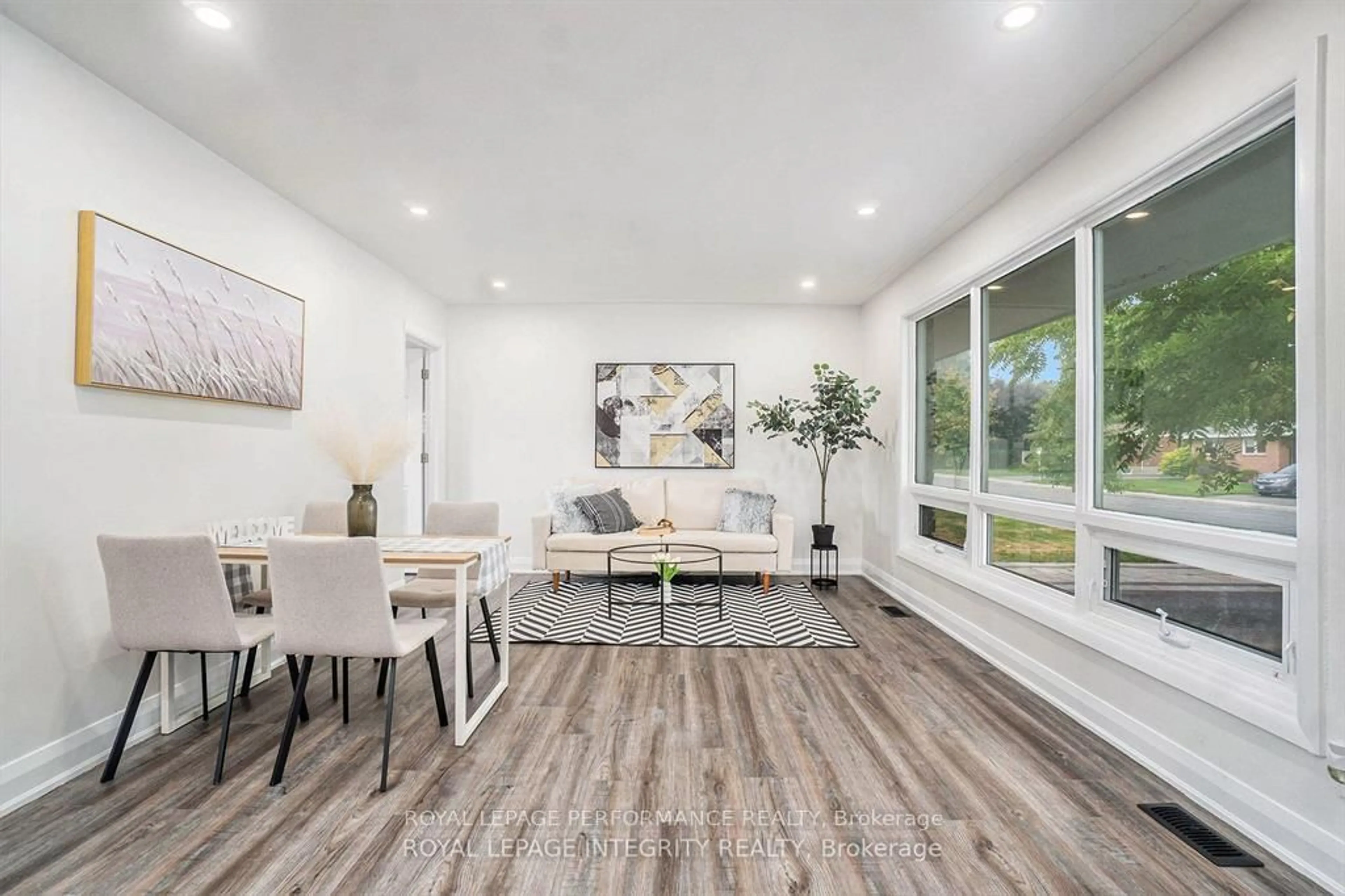 Living room with furniture, wood/laminate floor for 26 Majestic Dr, Ottawa Ontario K2G 1C7