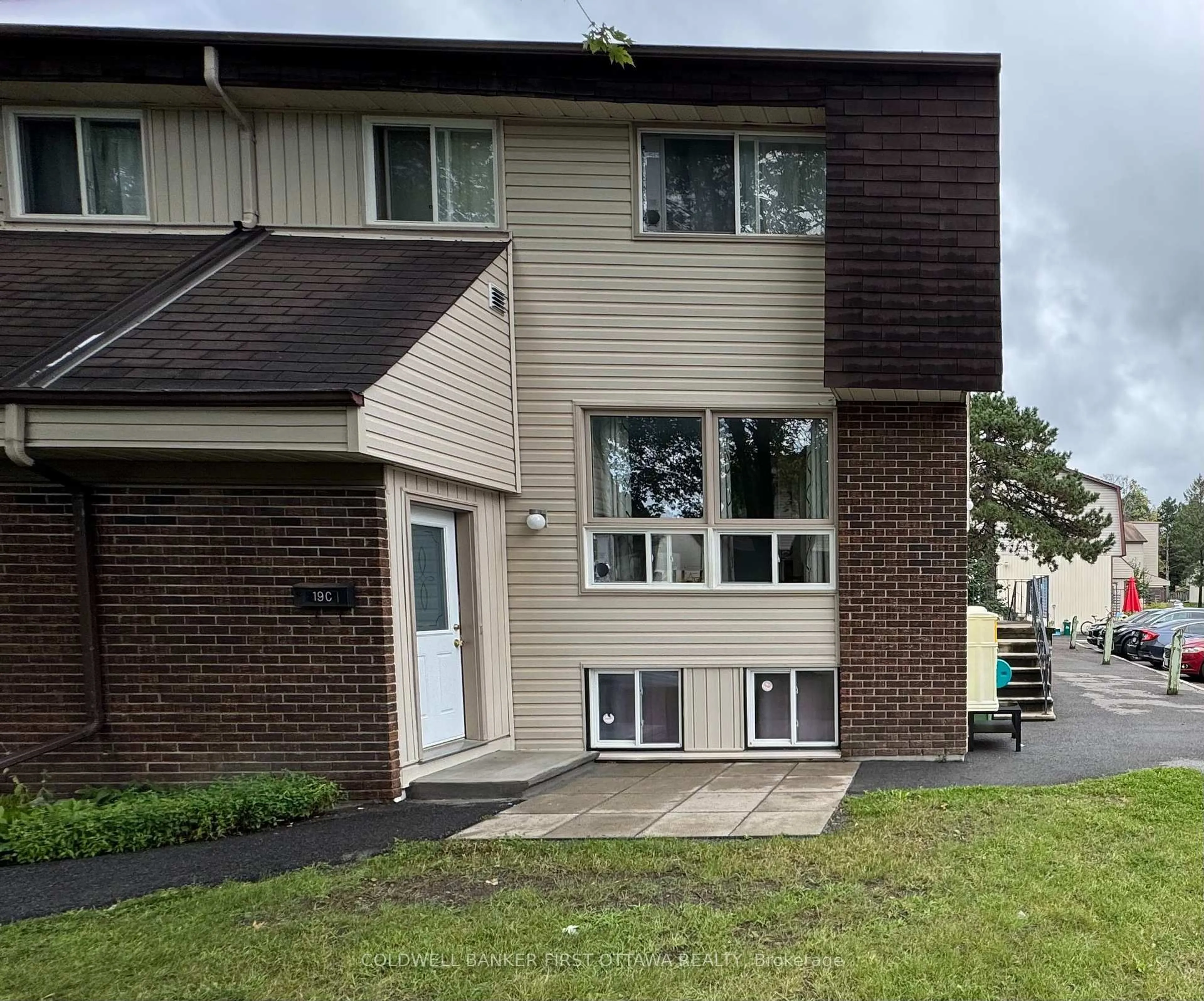 Home with vinyl exterior material, street for 19C Sonnet Cres, Ottawa Ontario K2H 8W8