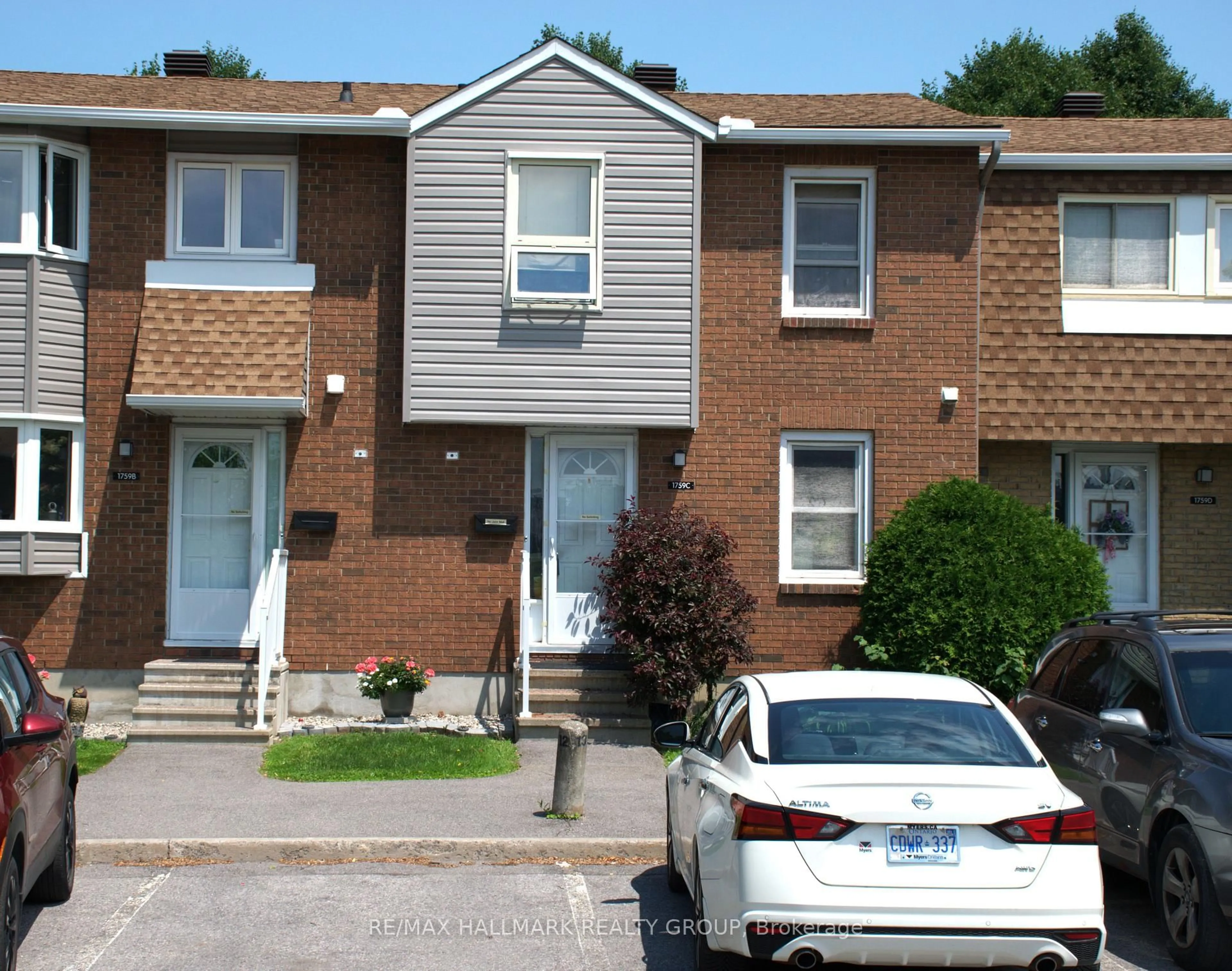 Home with brick exterior material, street for 1759 Lamoureux Dr #C, Ottawa Ontario K1E 2N5
