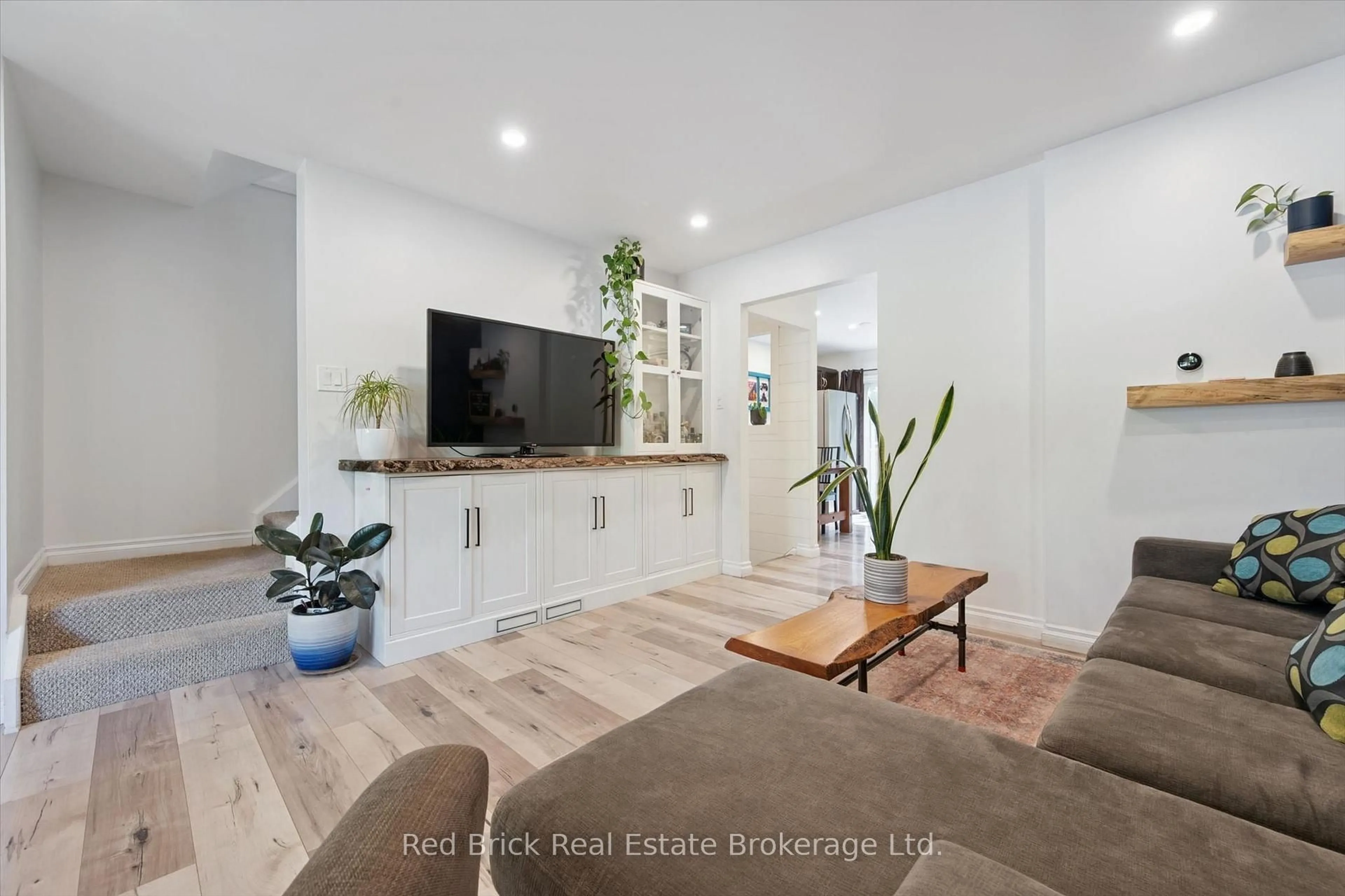 Living room with furniture, wood/laminate floor for 436 Willow Rd, Guelph Ontario N1H 6S2