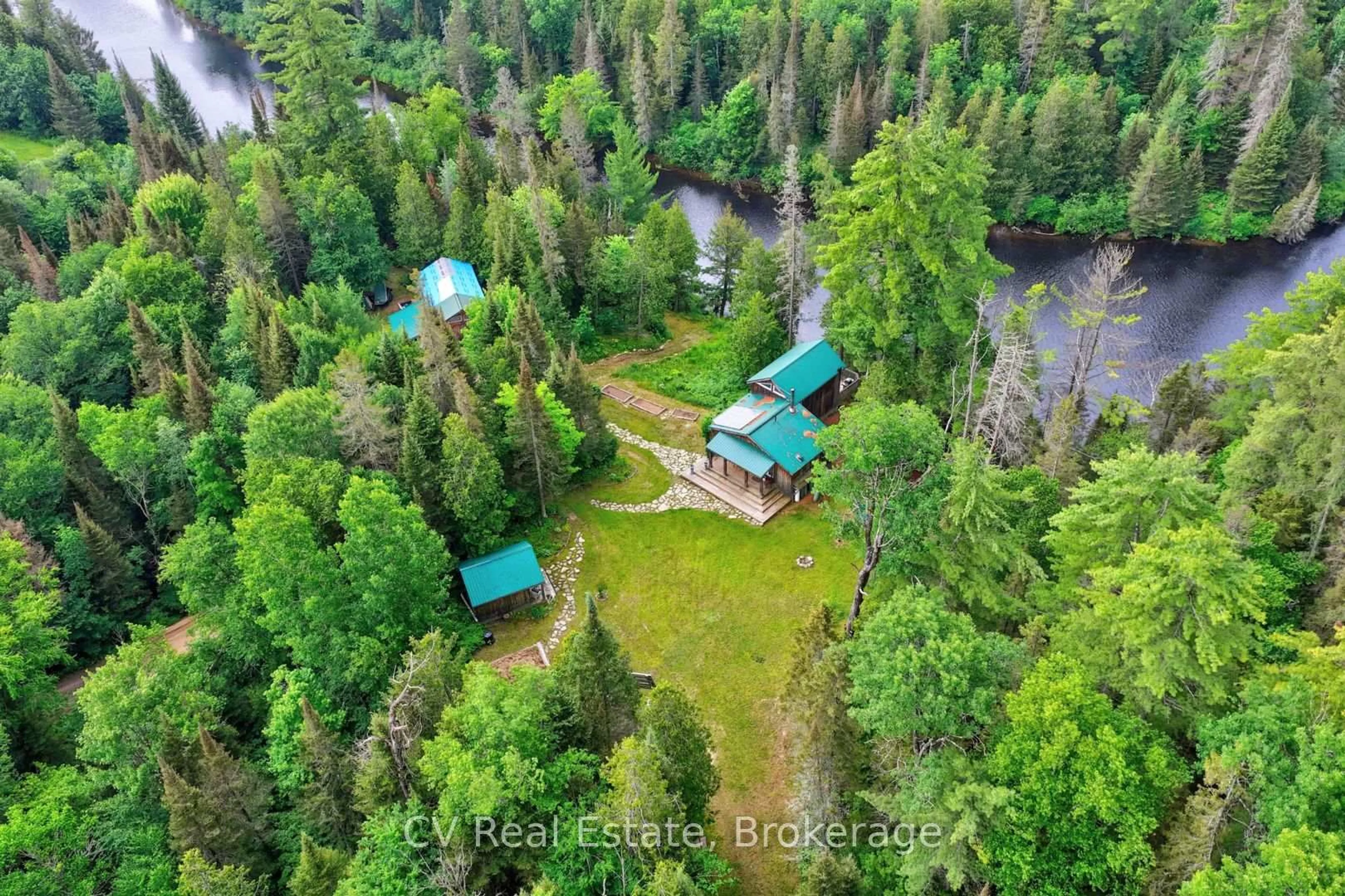 A pic from outside/outdoor area/front of a property/back of a property/a pic from drone, forest/trees view for 625 Chetwynd Rd, Armour Ontario P0A 1C0