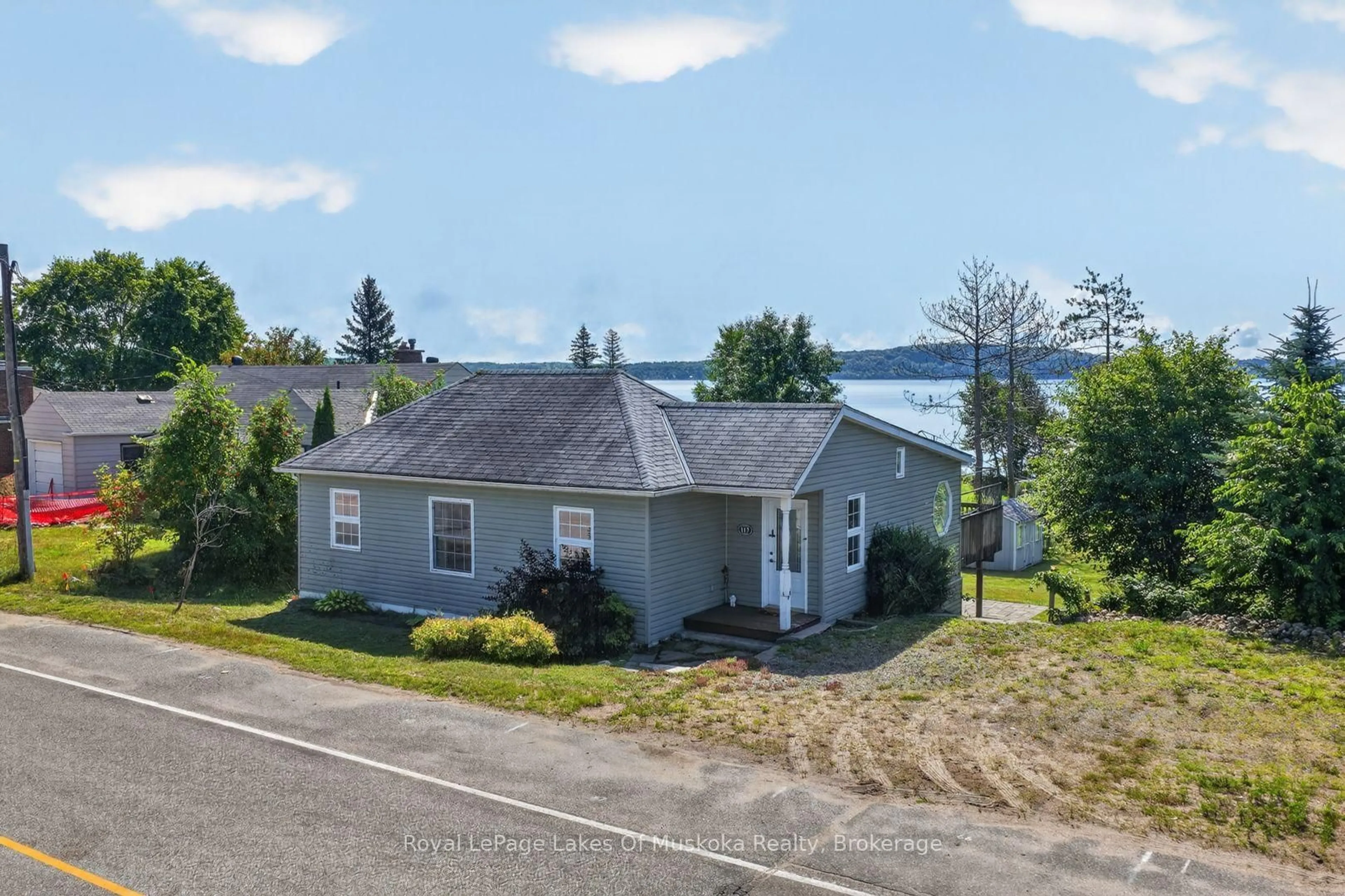 A pic from outside/outdoor area/front of a property/back of a property/a pic from drone, water/lake/river/ocean view for 117 Main St, Sundridge Ontario P0A 1Z0