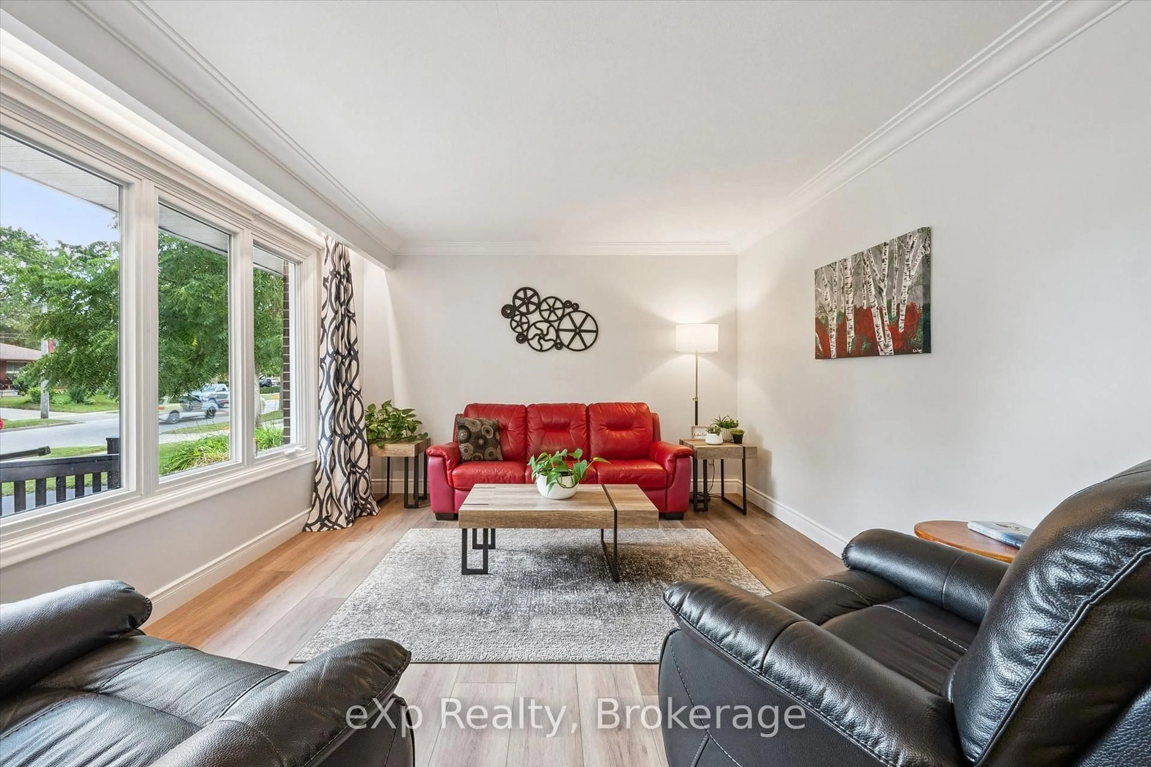 Living room with furniture, wood/laminate floor for 18 Eleanor Crt, Guelph Ontario N1E 1S8