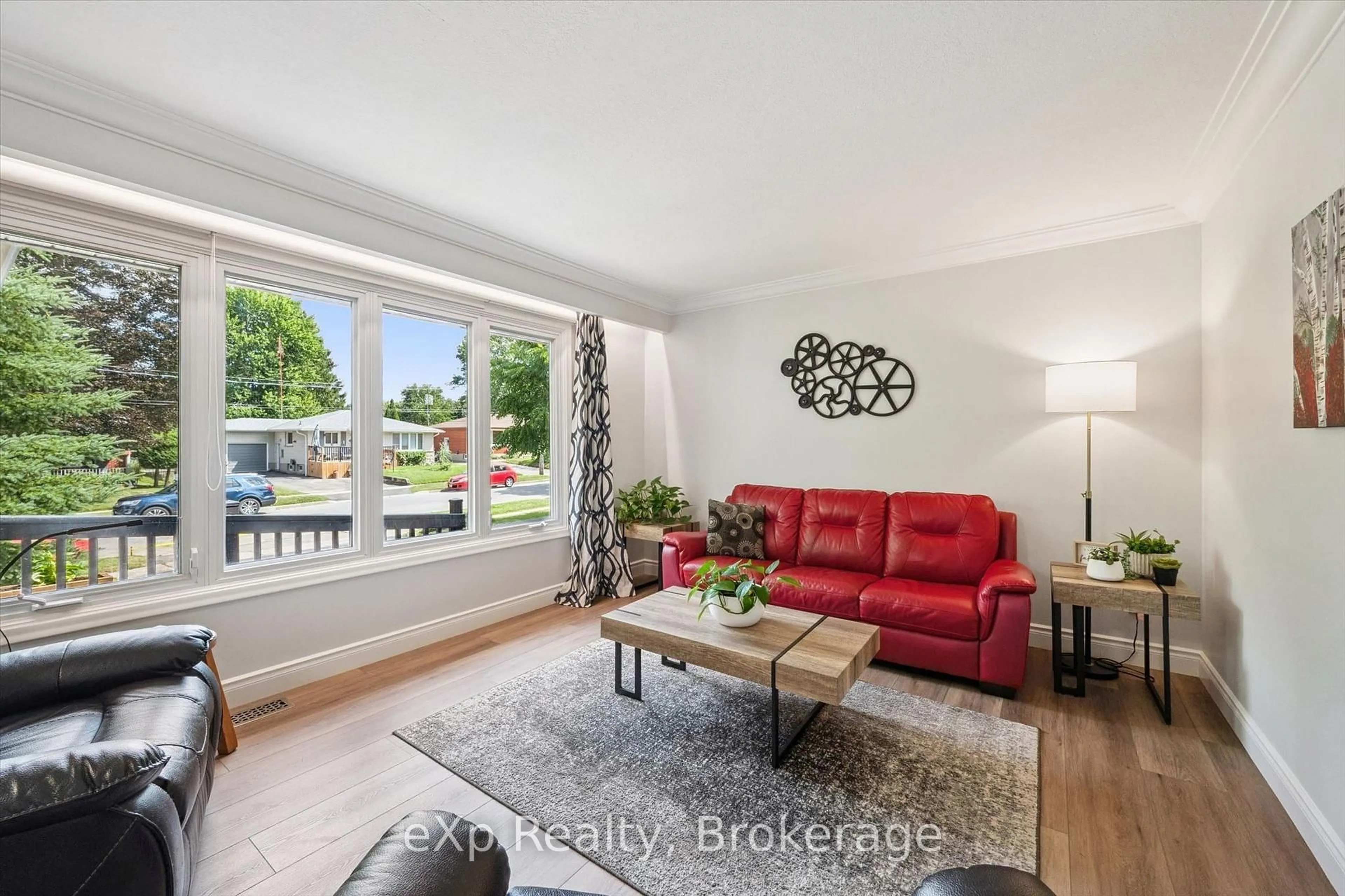 Living room with furniture, wood/laminate floor for 18 Eleanor Crt, Guelph Ontario N1E 1S8