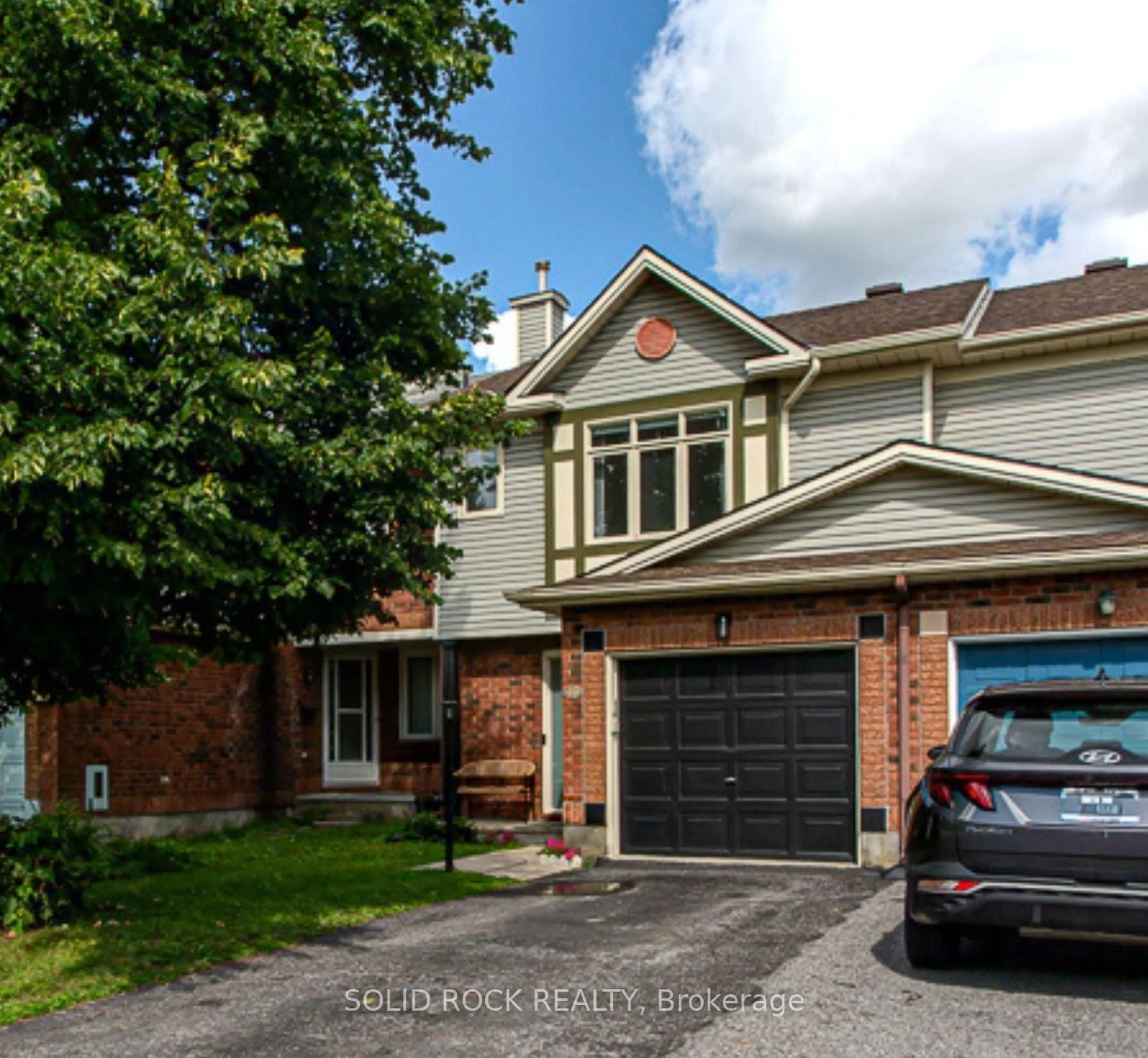 Home with brick exterior material, street for 49 Longshire Circ, Ottawa Ontario K2J 4K7