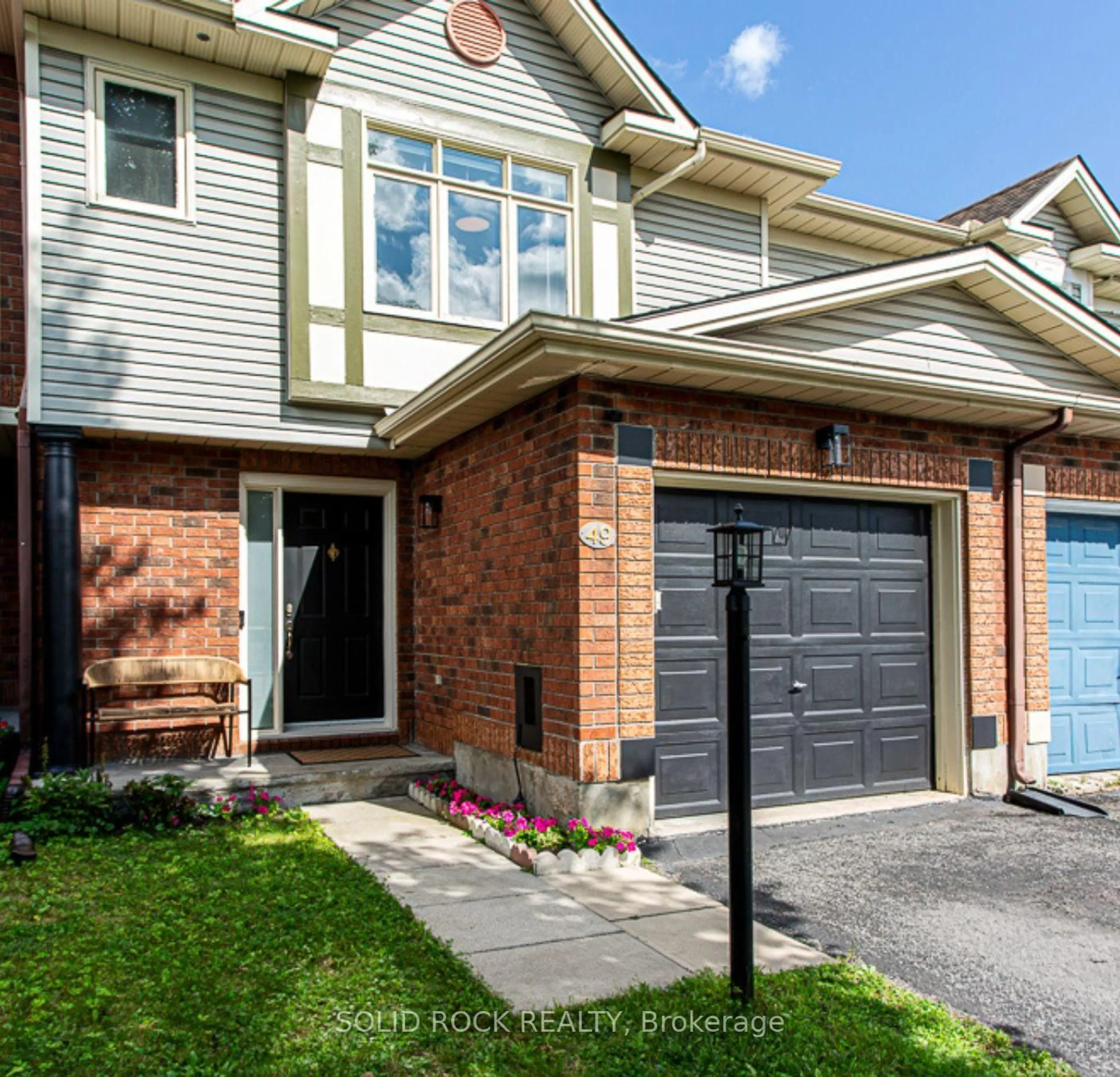 Home with brick exterior material, street for 49 Longshire Circ, Ottawa Ontario K2J 4K7