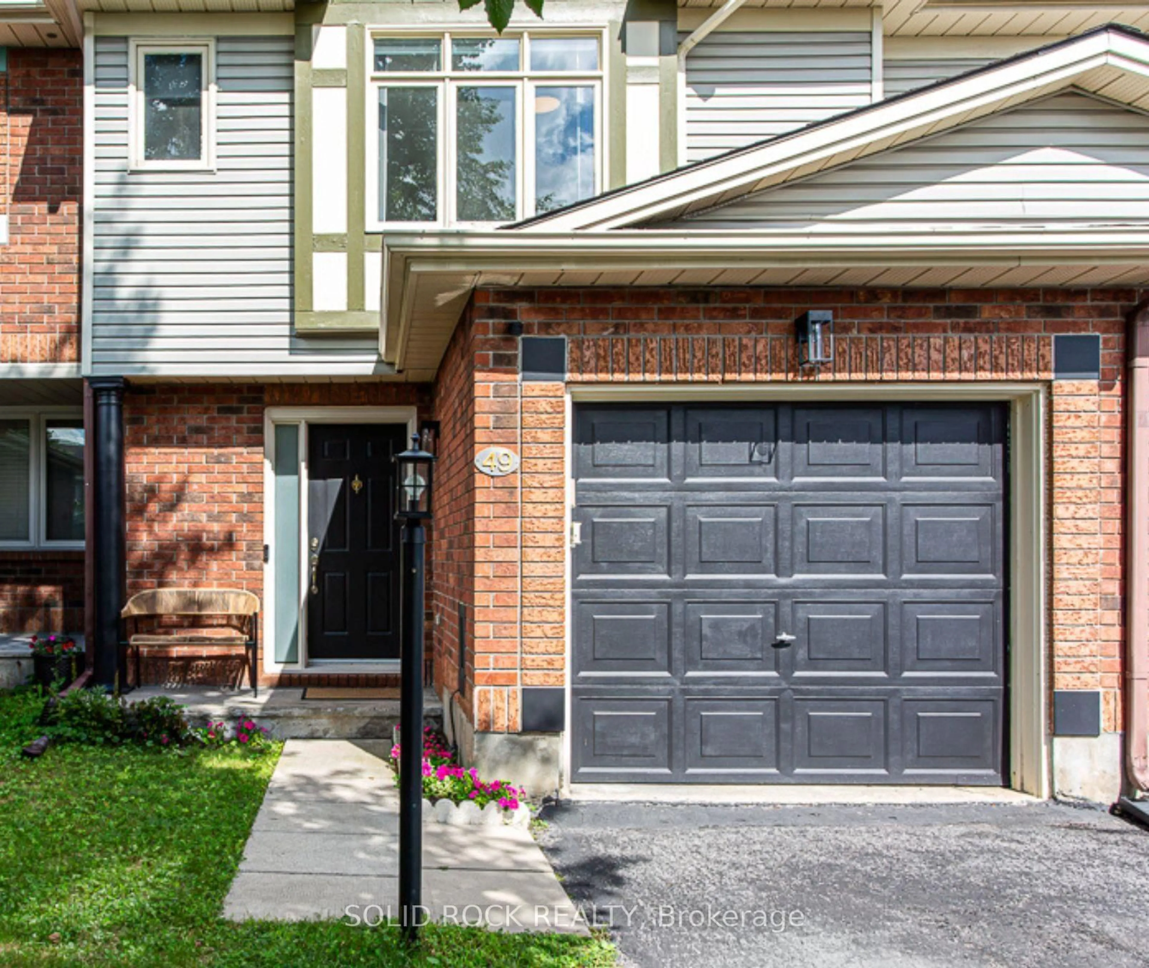 Home with brick exterior material, street for 49 Longshire Circ, Ottawa Ontario K2J 4K7