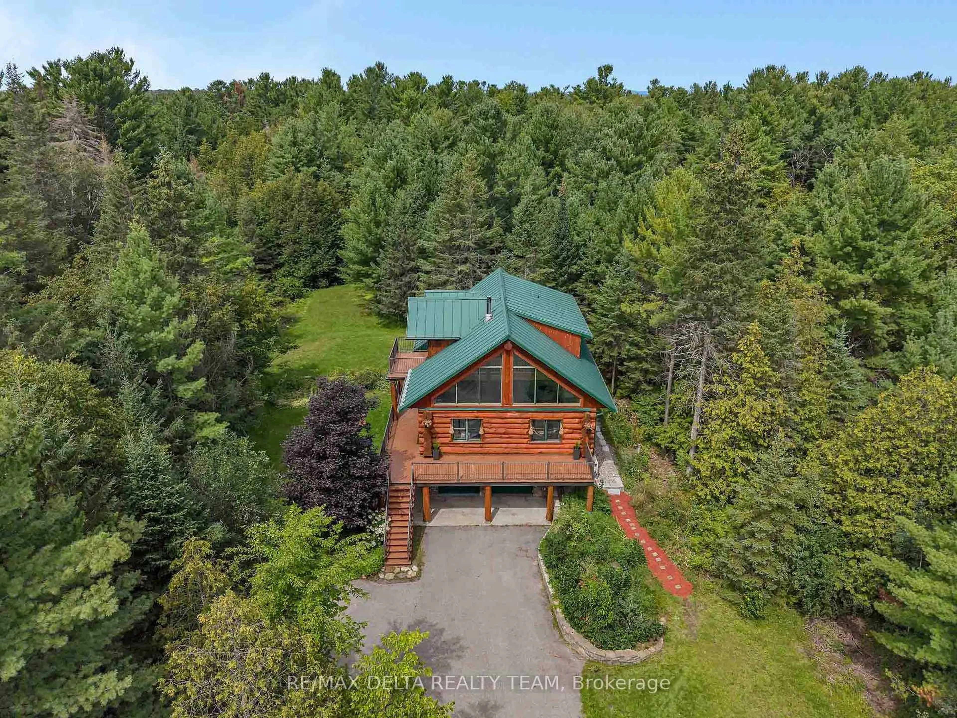 A pic from outside/outdoor area/front of a property/back of a property/a pic from drone, forest/trees view for 107 Corkery Woods Dr, Carp Ontario K0A 1L0
