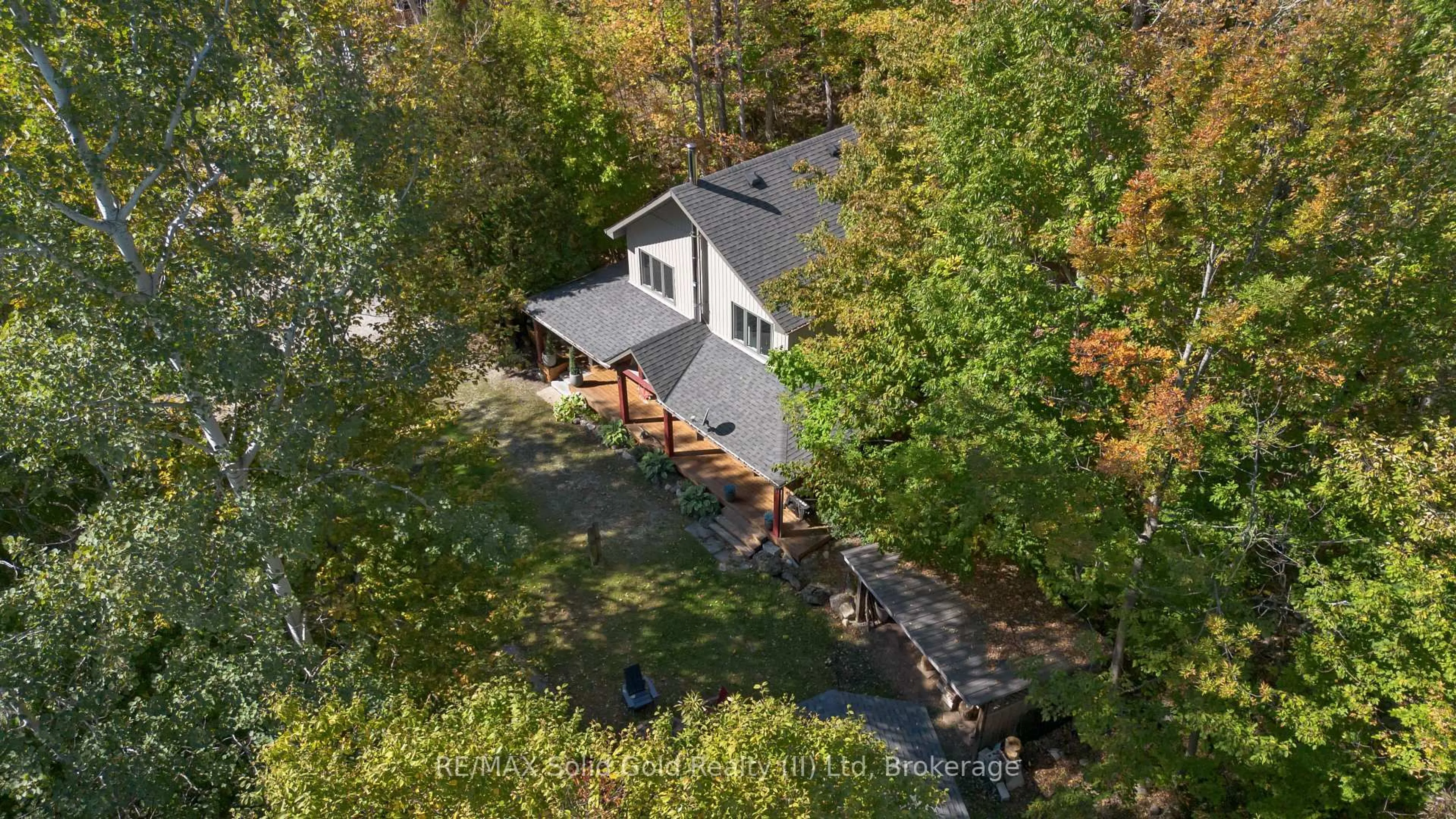 A pic from outside/outdoor area/front of a property/back of a property/a pic from drone, forest/trees view for 8 15th Ave, South Bruce Peninsula Ontario N0H 2T0