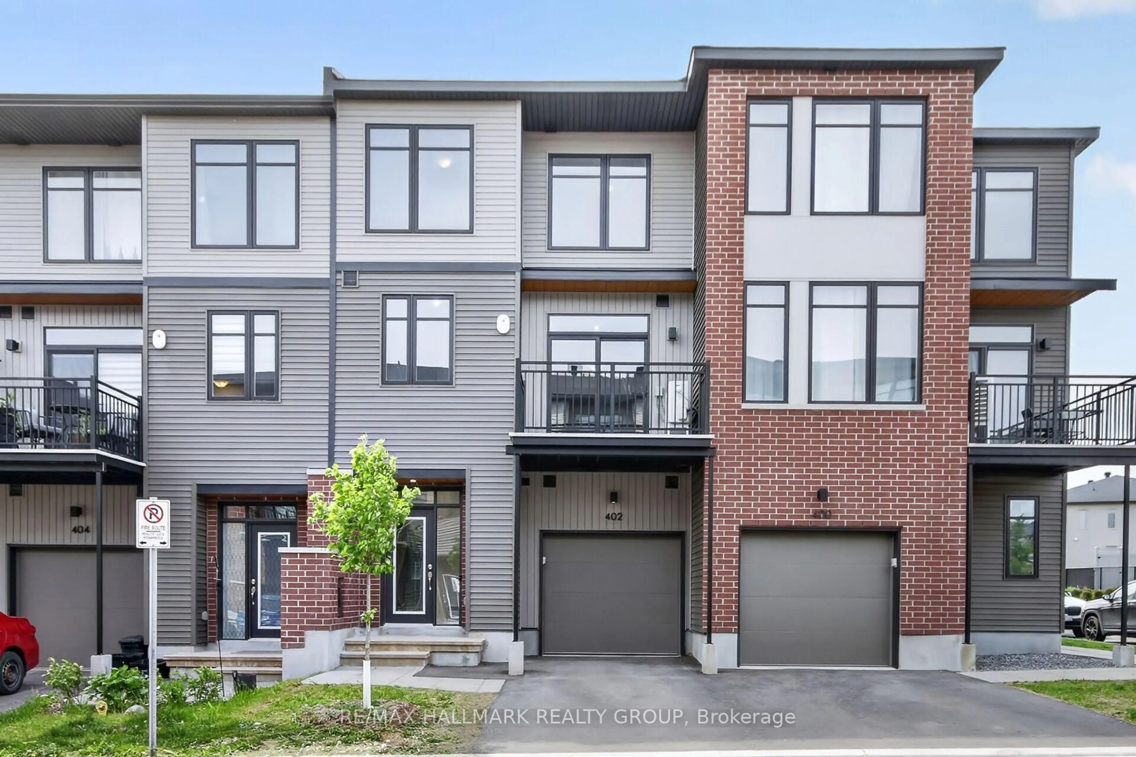 Home with brick exterior material, street for 402 JEWELWING Private, Ottawa Ontario K1X 0M7