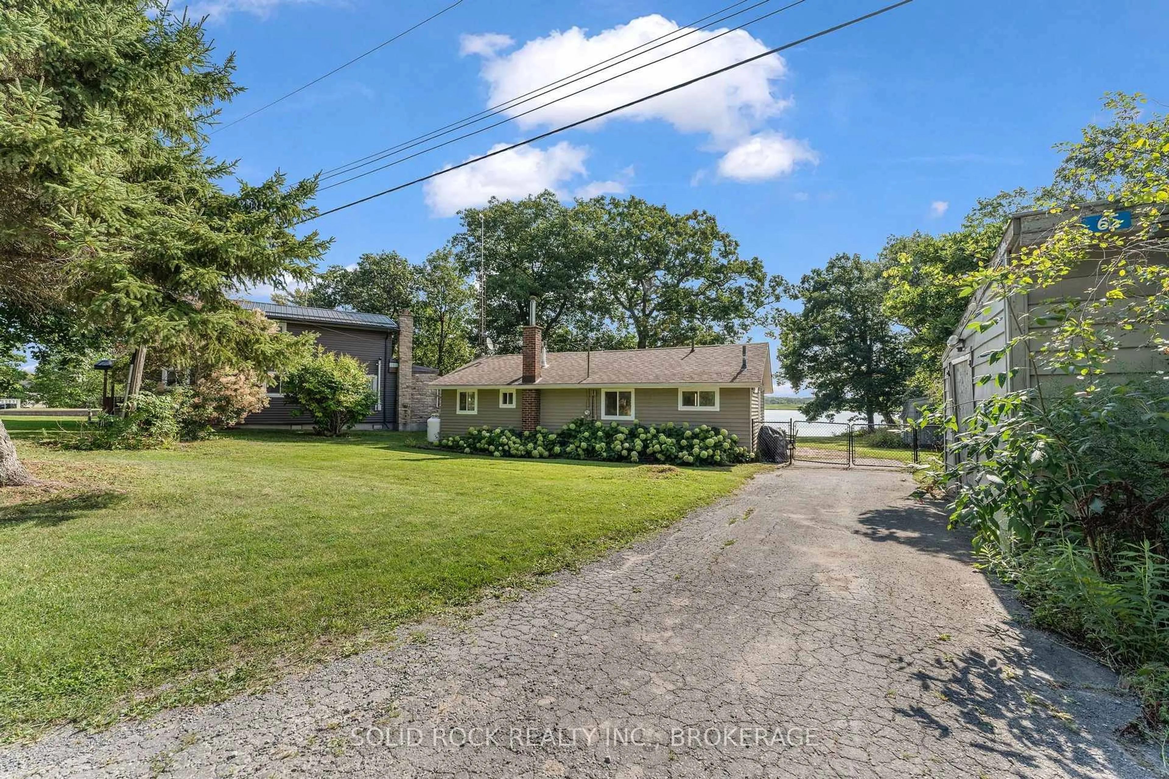 A pic from outside/outdoor area/front of a property/back of a property/a pic from drone, street for 65 Blue Heron Lane, Gananoque Ontario K7G 2V6