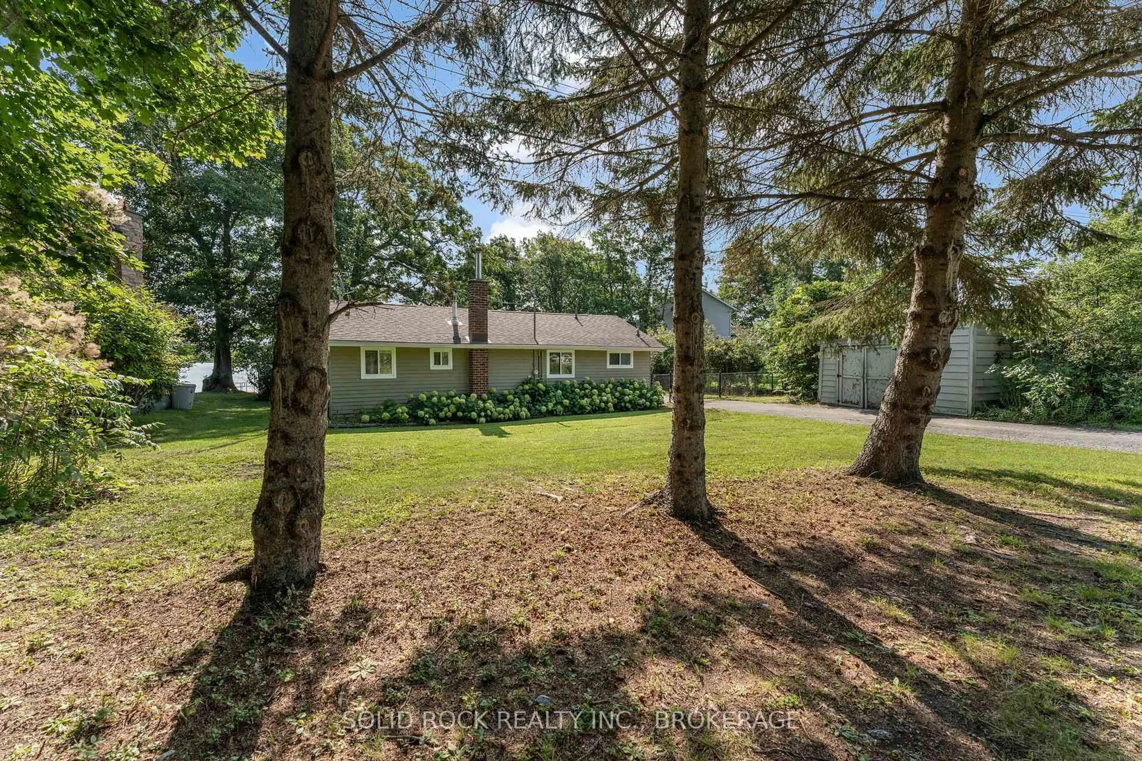 A pic from outside/outdoor area/front of a property/back of a property/a pic from drone, unknown for 65 Blue Heron Lane, Gananoque Ontario K7G 2V6