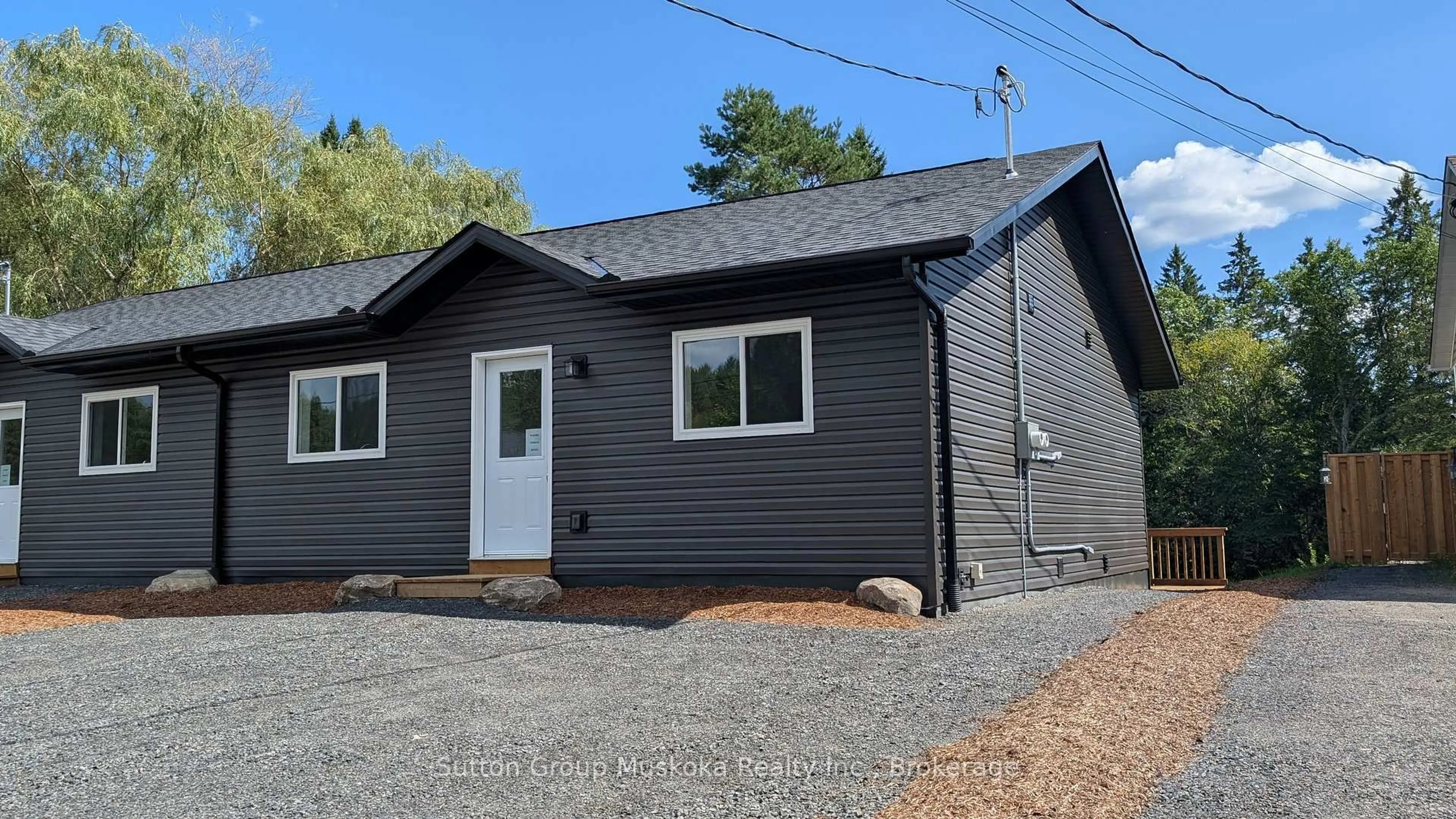 Home with vinyl exterior material, street for 79 Chaffey Township Rd, Huntsville Ontario P1H 1C8