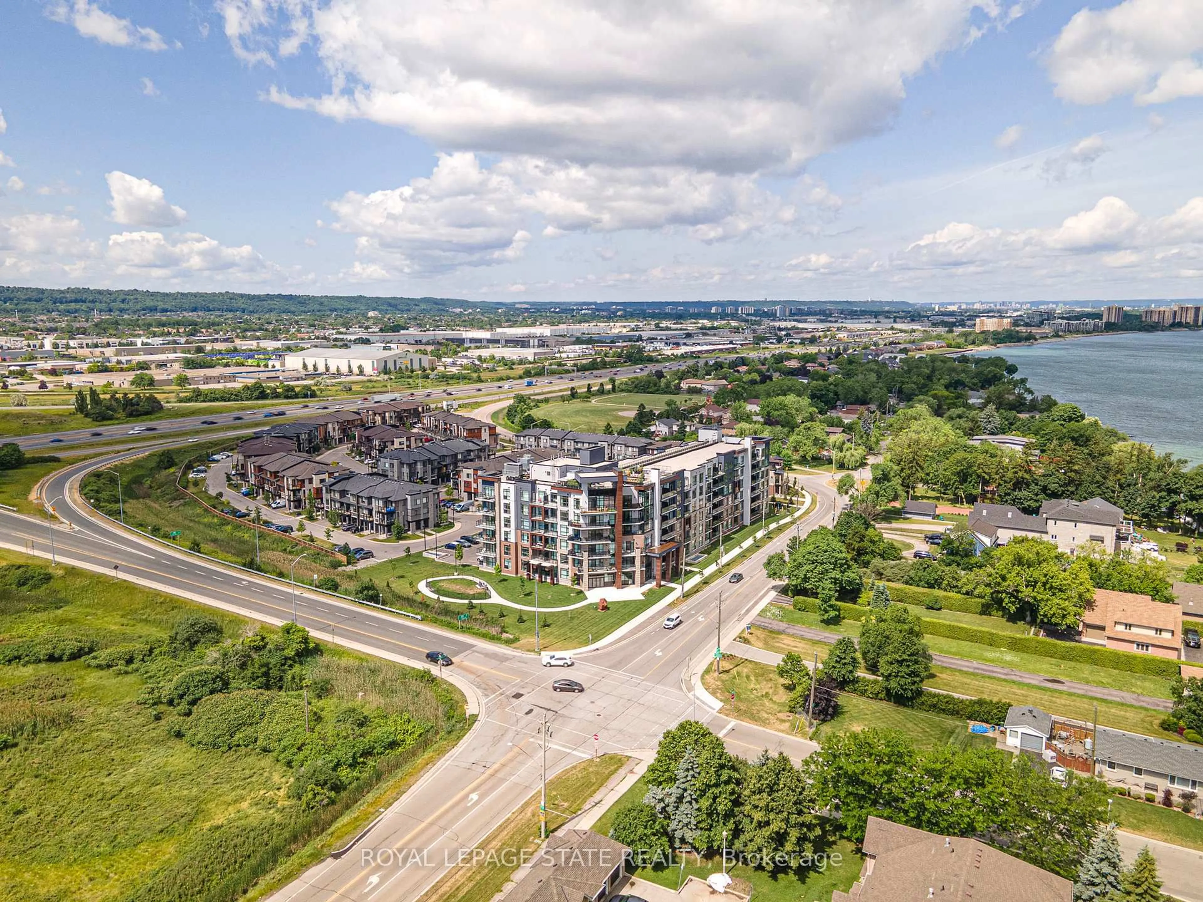A pic from outside/outdoor area/front of a property/back of a property/a pic from drone, water/lake/river/ocean view for 600 North Service Rd #301, Hamilton Ontario L8E 0L2